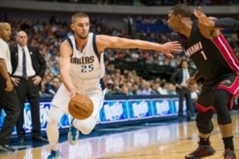 Nov 9, 2014; Dallas, TX, USA; Dallas Mavericks forward Chandler Parsons (25) drives to the basket past Miami Heat center Chris Bosh (1) during the first quarter at the American Airlines Center. Mandatory Credit: Jerome Miron-USA TODAY Sports