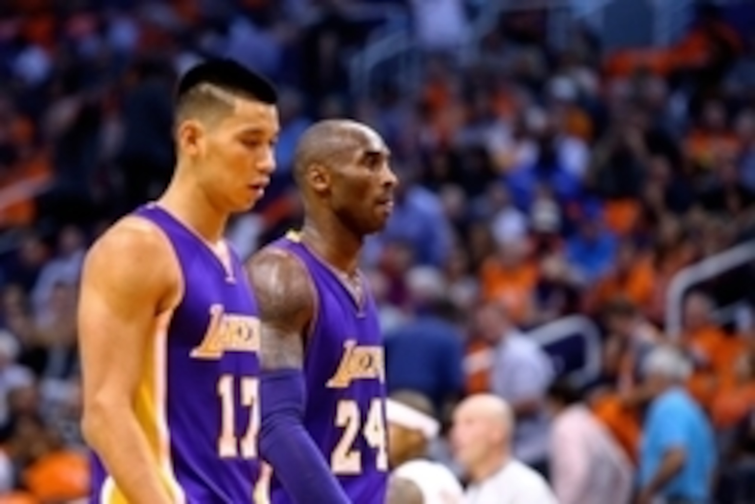 Oct 29, 2014; Phoenix, AZ, USA; Los Angeles Lakers guard Kobe Bryant (right) with guard Jeremy Lin against the Phoenix Suns during the home opener at US Airways Center. The Suns defeated the Lakers 119-99. Mandatory Credit: Mark J. Rebilas-USA TODAY Sport