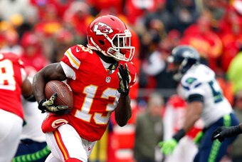 KANSAS CITY, MO - NOVEMBER 16:   De'Anthony Thomas #13 of the Kansas City Chiefs runs the ball against the Seattle Seahawks during the first half at Arrowhead Stadium on November 16, 2014 in Kansas City, Missouri.  (Photo by Wesley Hitt/Getty Images)