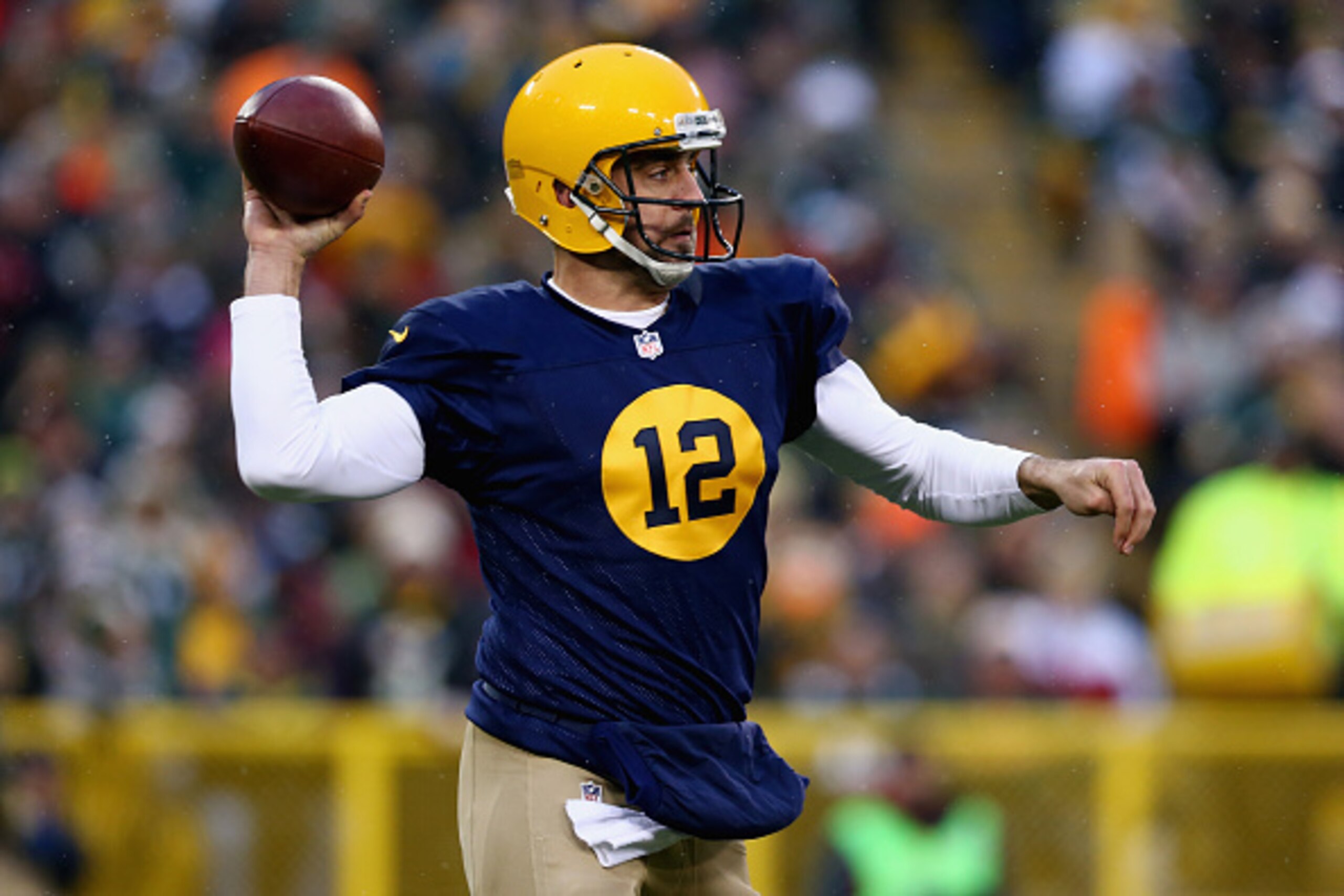 GREEN BAY, WI - NOVEMBER 16:  Quarterback  Aaron Rodgers #12 of the Green Bay Packers looks to pass against the Philadelphia Eagles during the first quarter of the game at Lambeau Field on November 16, 2014 in Green Bay, Wisconsin.  (Photo by Ronald Marti