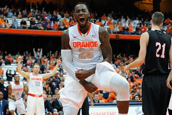SYRACUSE, NY - NOVEMBER 02:  Rakeem Christmas #25 of the Syracuse Orange reacts to a dunk against the Carleton Ravens during the second half at the Carrier Dome on November 2, 2014 in Syracuse, New York.  Syracuse defeated Carleton 76-68.  (Photo by Rich 