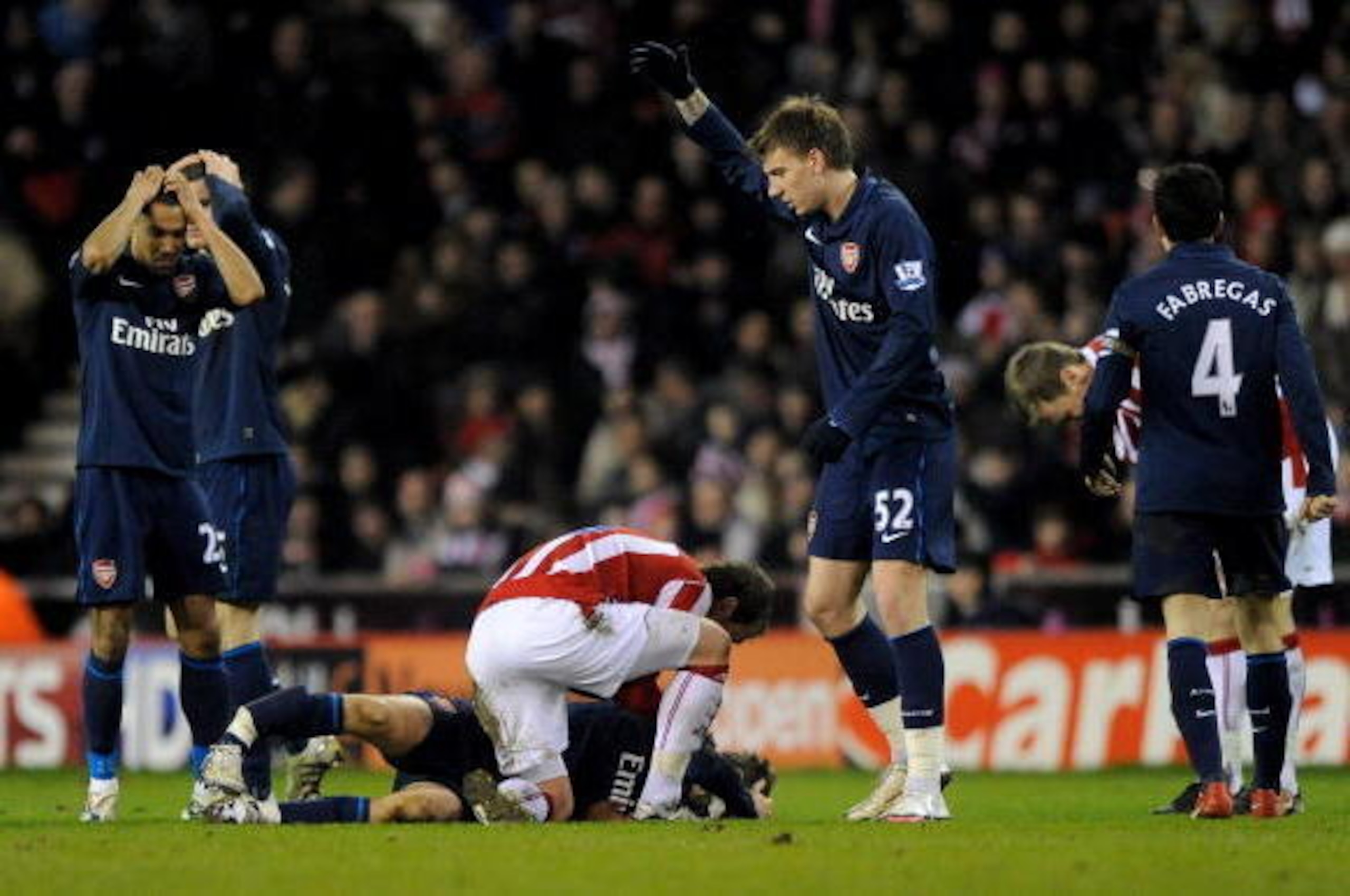 STOKE ON TRENT, ENGLAND - FEBRUARY 27:  Aaron Ramsey of Arsenal lies seriously injured following a challenge by Ryan Shawcross of Stoke City during the Barclays Premier League match between Stoke City and Arsenal at The Britannia Stadium on February 27, 2