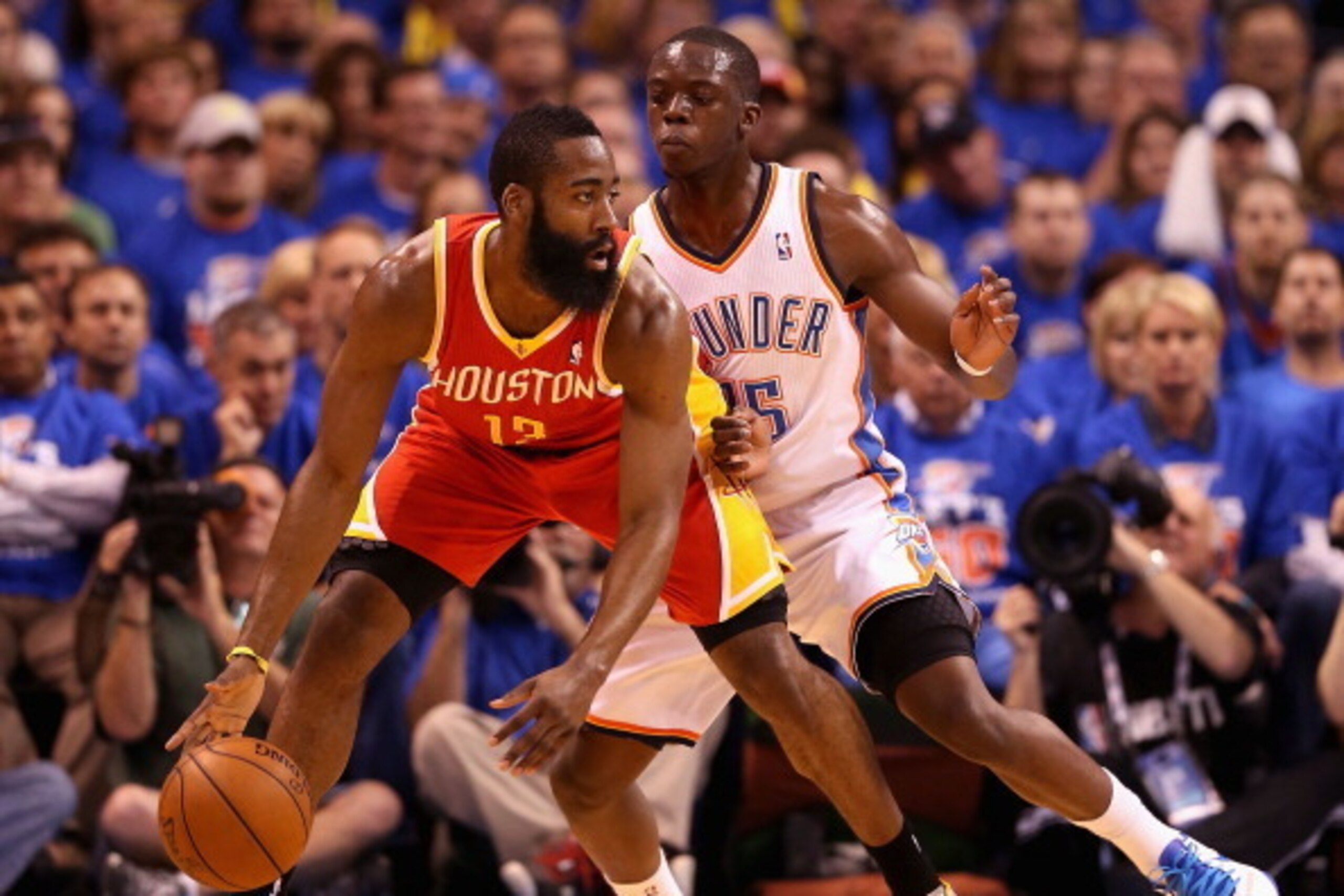 OKLAHOMA CITY, OK - MAY 01:  James Harden #13 of the Houston Rockets handles the ball guarded by Reggie Jackson #15 of the Oklahoma City Thunder during the first half of Game Five of the Western Conference Quarterfinals of the 2013 NBA Playoffs at Chesape