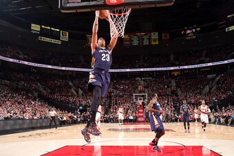 PORTLAND, OR - NOVEMBER 17:  Anthony Davis #23 of the New Orleans Pelicans goes to the basket against the Portland Trail Blazers on November 17, 2014 at the Moda Center in Portland, Oregon. NOTE TO USER: User expressly acknowledges and agrees that, by dow
