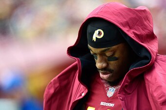 LANDOVER, MD - NOVEMBER 16: Quarterback Robert Griffin III #10 of the Washington Redskins of the Washington Redskins looks on in the second half of a game against the Tampa Bay Buccaneers at FedExField on November 16, 2014 in Landover, Maryland.  (Photo b