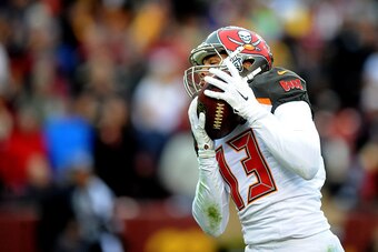 LANDOVER, MD - NOVEMBER 16: Wide receiver Mike Evans #13 of the Tampa Bay Buccaneers catches a fourth quarter touchdown against the Washington Redskins at FedExField on November 16, 2014 in Landover, Maryland.  (Photo by Mitchell Layton/Getty Images)