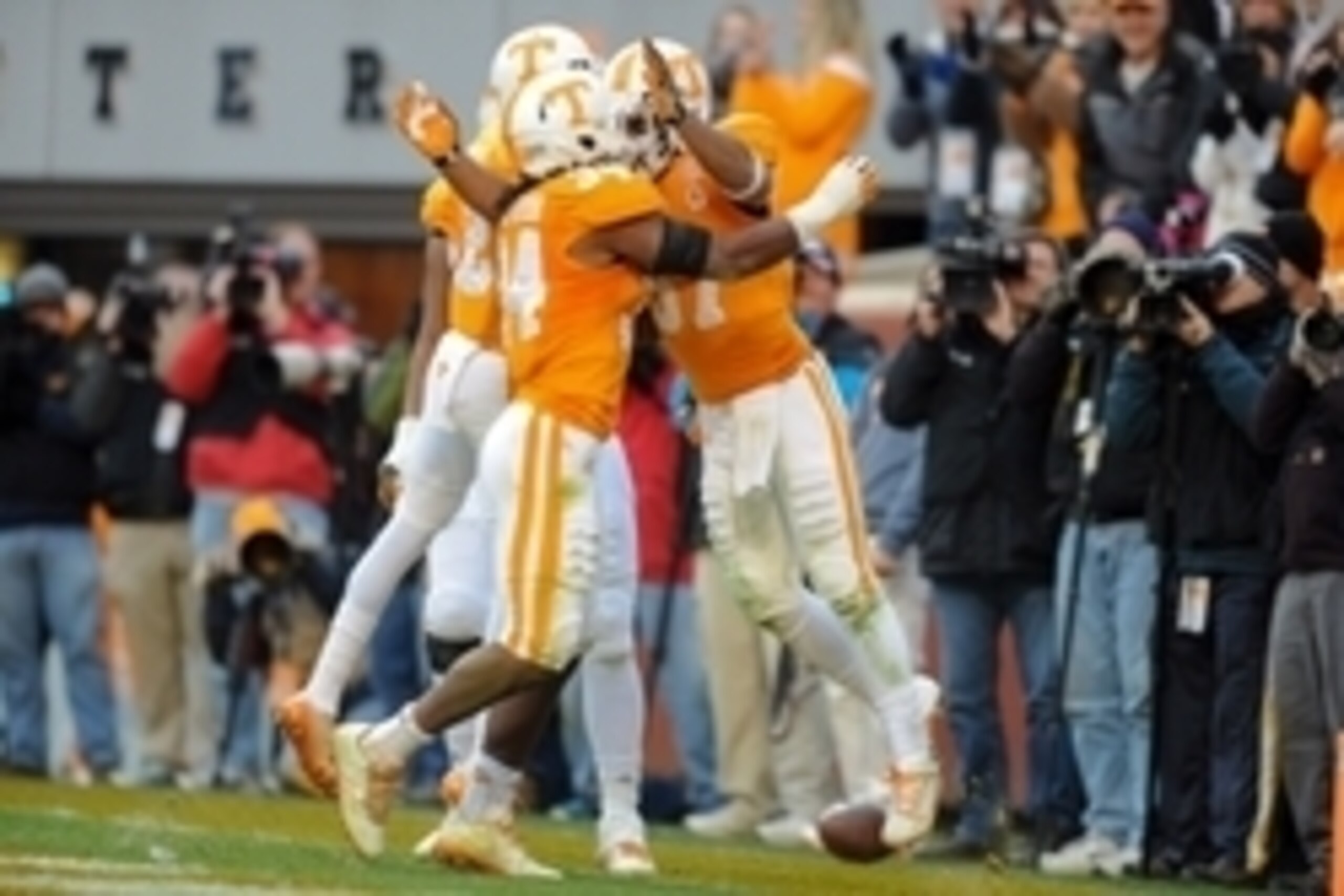 Nov 15, 2014; Knoxville, TN, USA; Tennessee Volunteers defensive back Brian Randolph (37) and linebacker Jalen Reeves-Maybin (34) celebrate a defensive touchdown against the Kentucky Wildcats during the first half at Neyland Stadium. Mandatory Credit: Ran