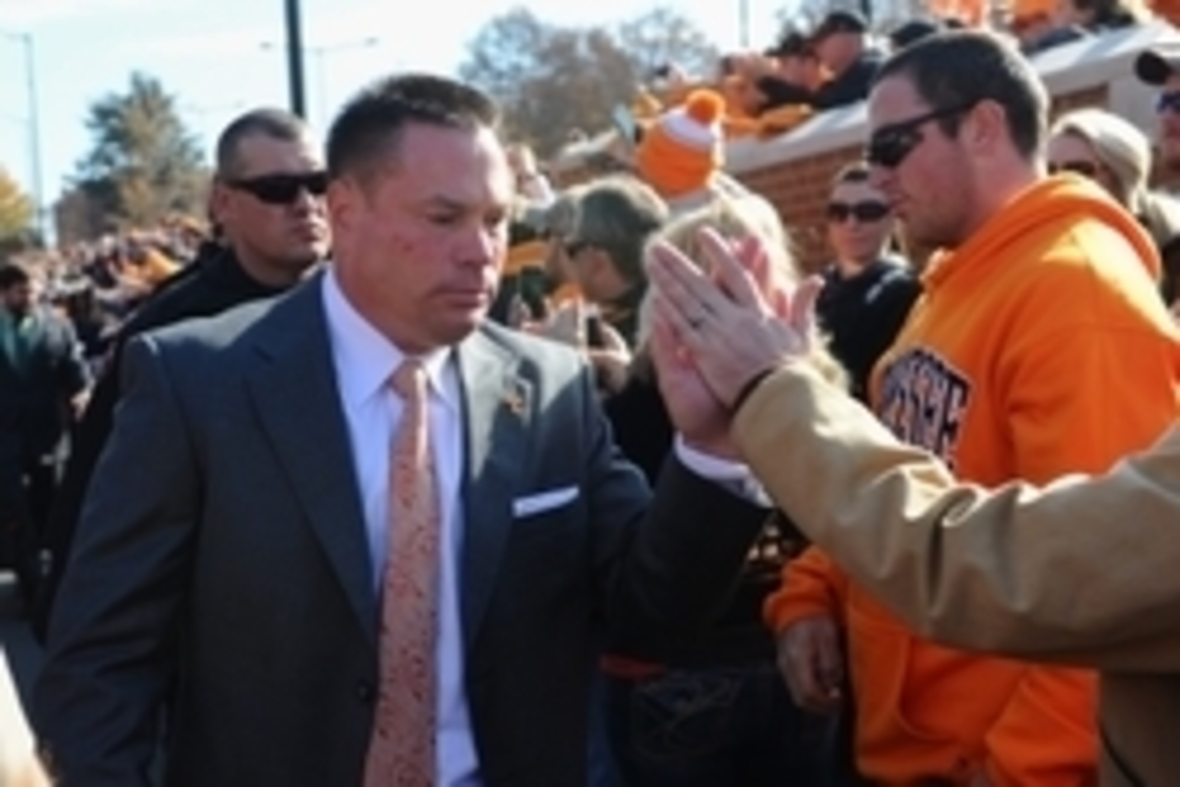 Nov 15, 2014; Knoxville, TN, USA; Tennessee Volunteers head coach Butch Jones (left) high fives fans during the Vol Walk prior to the game against the Kentucky Wildcats at Neyland Stadium. Mandatory Credit: Randy Sartin-USA TODAY Sports