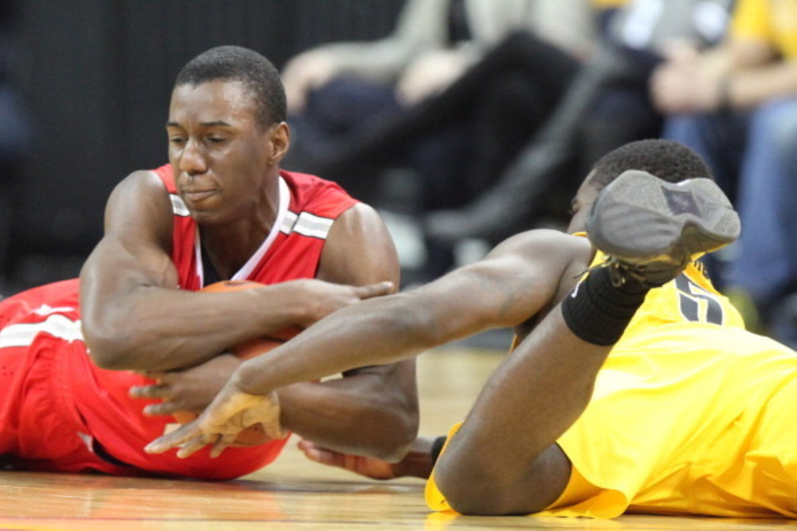 IOWA CITY, IA - FEBRUARY 04:  Guard Shannon Scott #3 of the Ohio State Buckeyes grabs a loose ball during the first half in against guard Anthony Clemmons #5 of the Iowa Hawkeyes on February 4, 2014 at Carver-Hawkeye Arena, in Iowa City, Iowa. (Photo by M