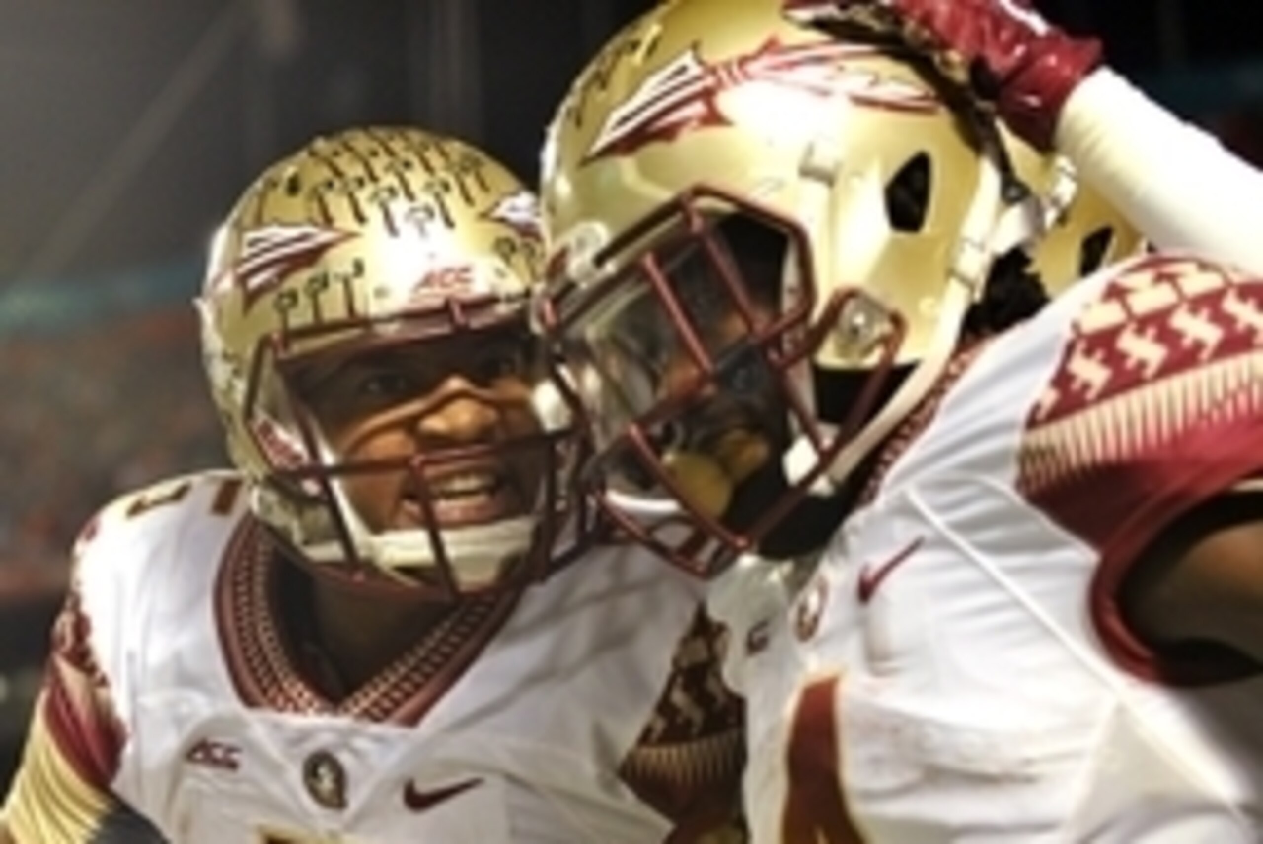 Nov 15, 2014; Miami Gardens, FL, USA; Florida State Seminoles quarterback Jameis Winston (left) celebrates with running back Dalvin Cook (right) after Cook scored a touchdown against the Miami Hurricanes during the second half at Sun Life Stadium.  FSU wo