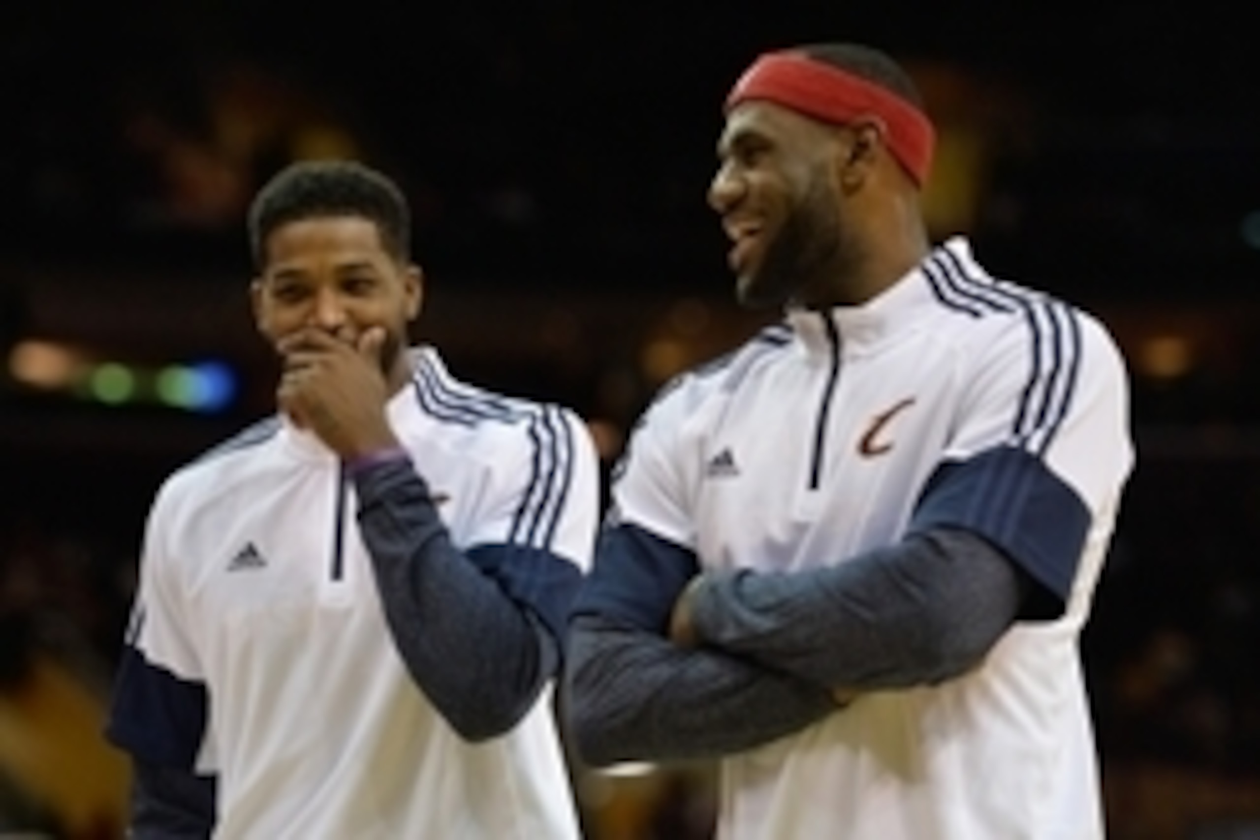 Oct 14, 2014; Cleveland, OH, USA; Cleveland Cavaliers forward LeBron James (right) reacts with forward Tristan Thompson (13) during a timeout against the Milwaukee Bucks at Quicken Loans Arena. Cleveland won 106-100. Mandatory Credit: David Richard-USA TO