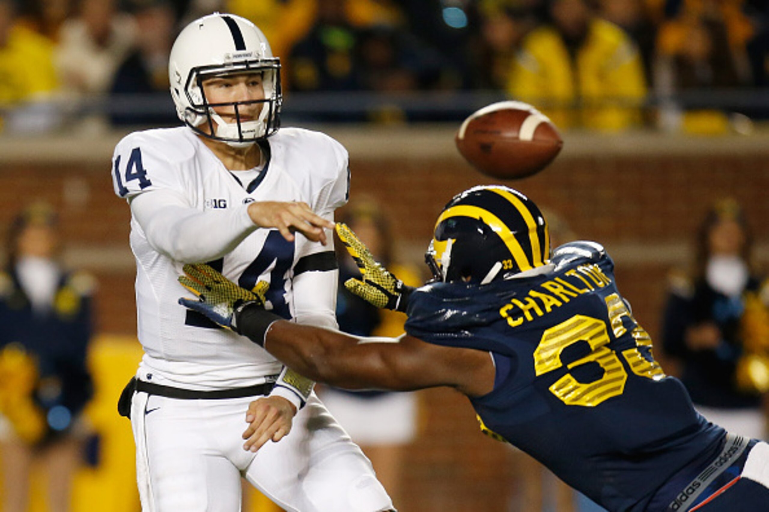 ANN ARBOR, MI - OCTOBER 11: Christian Hackenberg #14 of the Penn State Nittany Lions gets off a third quarter pass over Taco Charlton #33 of the Michigan Wolverines on October 11, 2014 at Michigan Stadium in Ann Arbor, Michigan. Michigan won the game 18-1 ANN ARBOR, MI - OCTOBER 11: Christian Hackenberg #14 of the Penn State Nittany Lions gets off a third quarter pass over Taco Charlton #33 of the Michigan Wolverines on October 11, 2014 at Michigan Stadium in Ann Arbor, Michigan. Michigan won the game 18-1