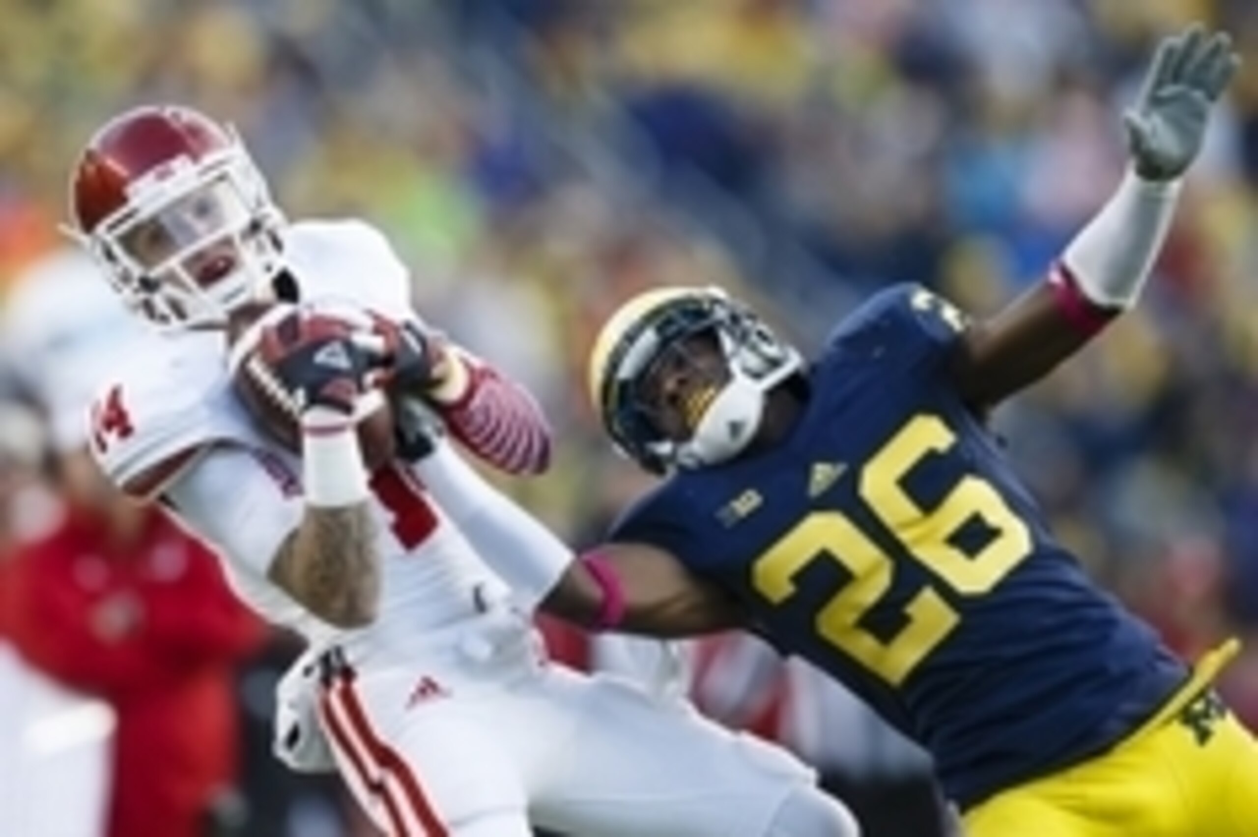 Oct 19, 2013; Ann Arbor, MI, USA; Indiana Hoosiers wide receiver Nick Stoner (14) makes a catch over Michigan Wolverines defensive back Jourdan Lewis (26) in the second half at Michigan Stadium. Michigan won 63-47. Mandatory Credit: Rick Osentoski-USA TOD Oct 19, 2013; Ann Arbor, MI, USA; Indiana Hoosiers wide receiver Nick Stoner (14) makes a catch over Michigan Wolverines defensive back Jourdan Lewis (26) in the second half at Michigan Stadium. Michigan won 63-47. Mandatory Credit: Rick Osentoski-USA TOD