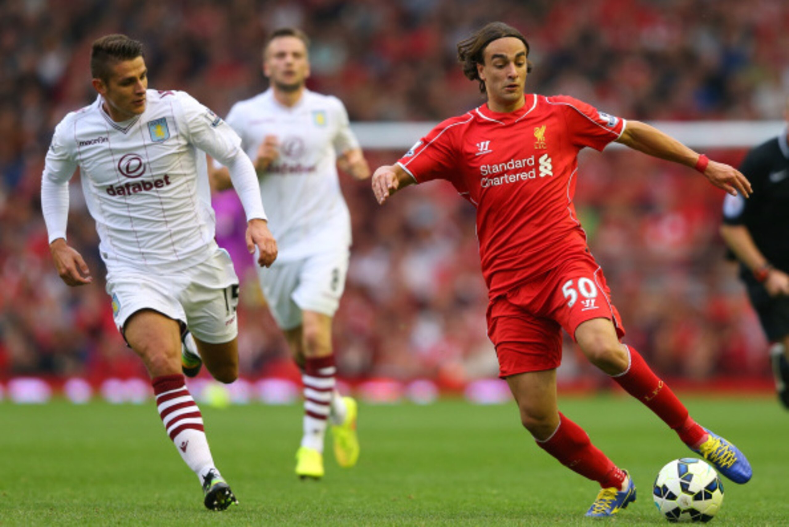 LIVERPOOL, ENGLAND - SEPTEMBER 13:  Lazar Markovic of Liverpool controls the ball under pressure from Ashley Westwood of Aston Villa during the Barclays Premier League match between Liverpool and Aston Villa at Anfield on September 13, 2014 in Liverpool, 