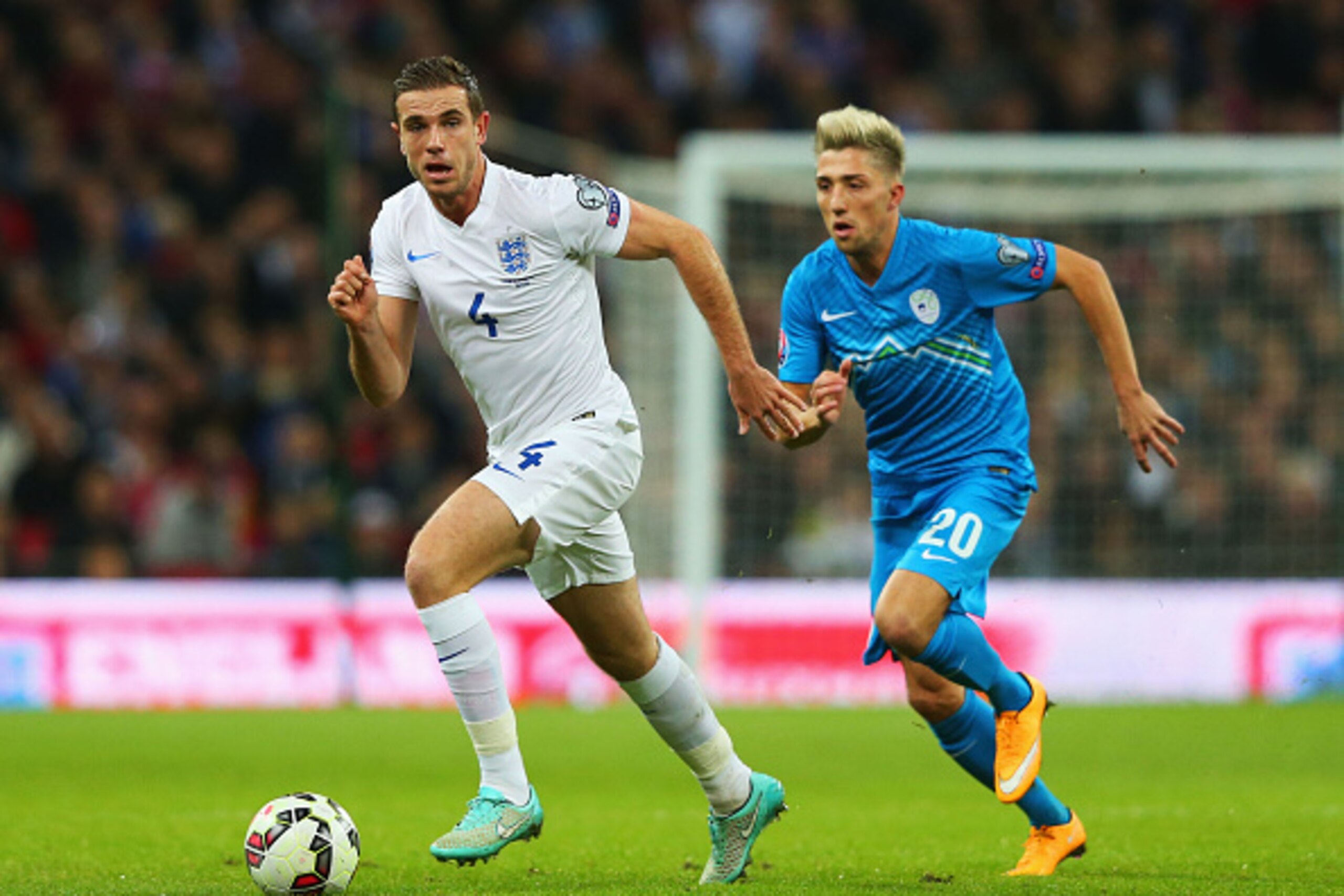 LONDON, ENGLAND - NOVEMBER 15:  Jordan Henderson of England is chased by Kevin Kampl of Slovenia during the EURO 2016 Qualifier Group E match between England and Slovenia at Wembley Stadium on November 15, 2014 in London, England.  (Photo by Alex Livesey/