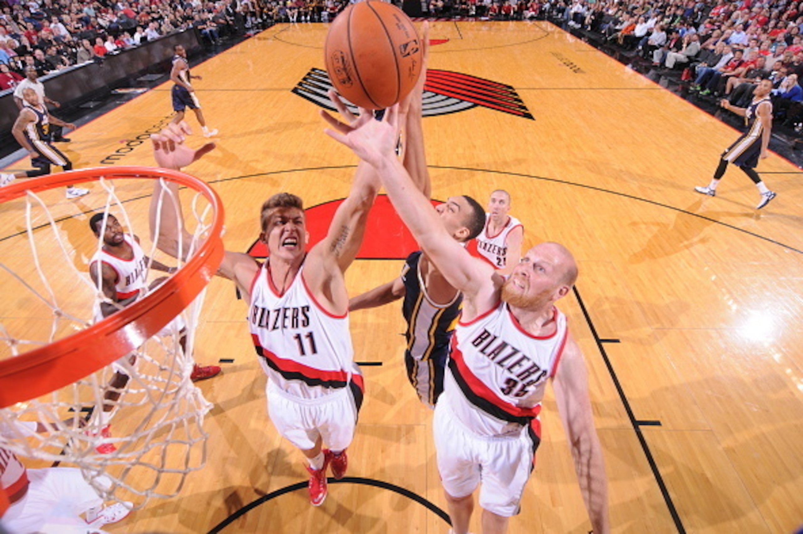 PORTLAND, OR - OCTOBER 9:  Meyers Leonard #11 of the Portland Trail Blazers and Chris Kaman #35 of play against the Utah Jazz on October 9, 2014 at the Moda Center Arena in Portland, Oregon. NOTE TO USER: User expressly acknowledges and agrees that, by do