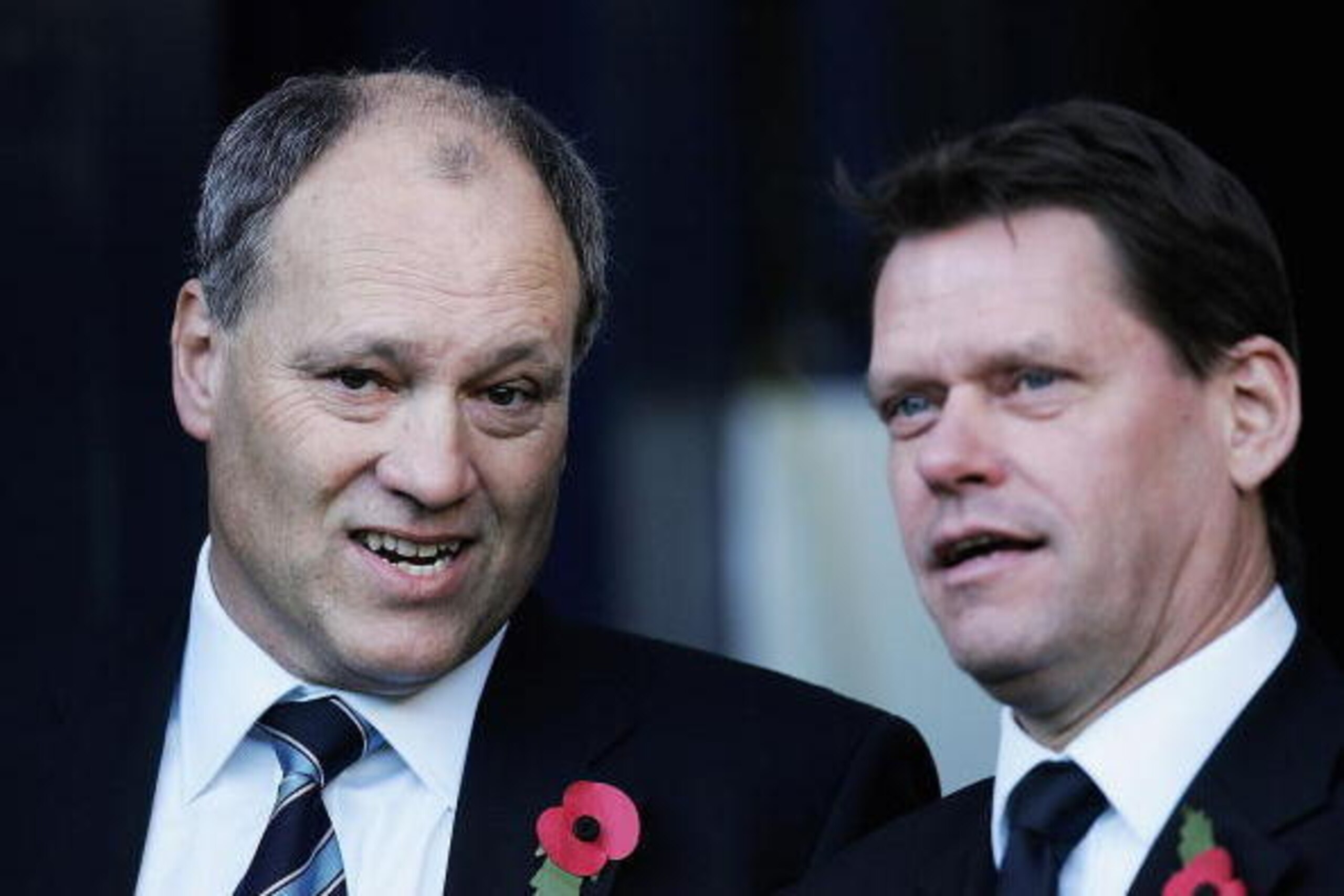 LONDON - NOVEMBER 13:  Martin Jol, (L), Tottenham Hotspurs new Manger, and Frank Arnesen, Tottenham Hotspurs Sporting Director, look on before the Barclays Premiership match between Tottenham Hotspur and Arsenal at White Hart Lane on November 13, 2004 in 