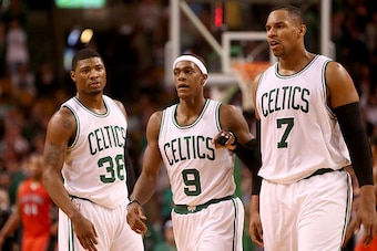 BOSTON, MA - NOVEMBER 05: Marcus Smart #36, Rajon Rondo #9 and Jared Sullinger #7 of the Boston Celtics look on after a play against the Toronto Raptors at TD Garden on November 5, 2014 in Boston, Massachusetts. NOTE TO USER: User expressly acknowledges a
