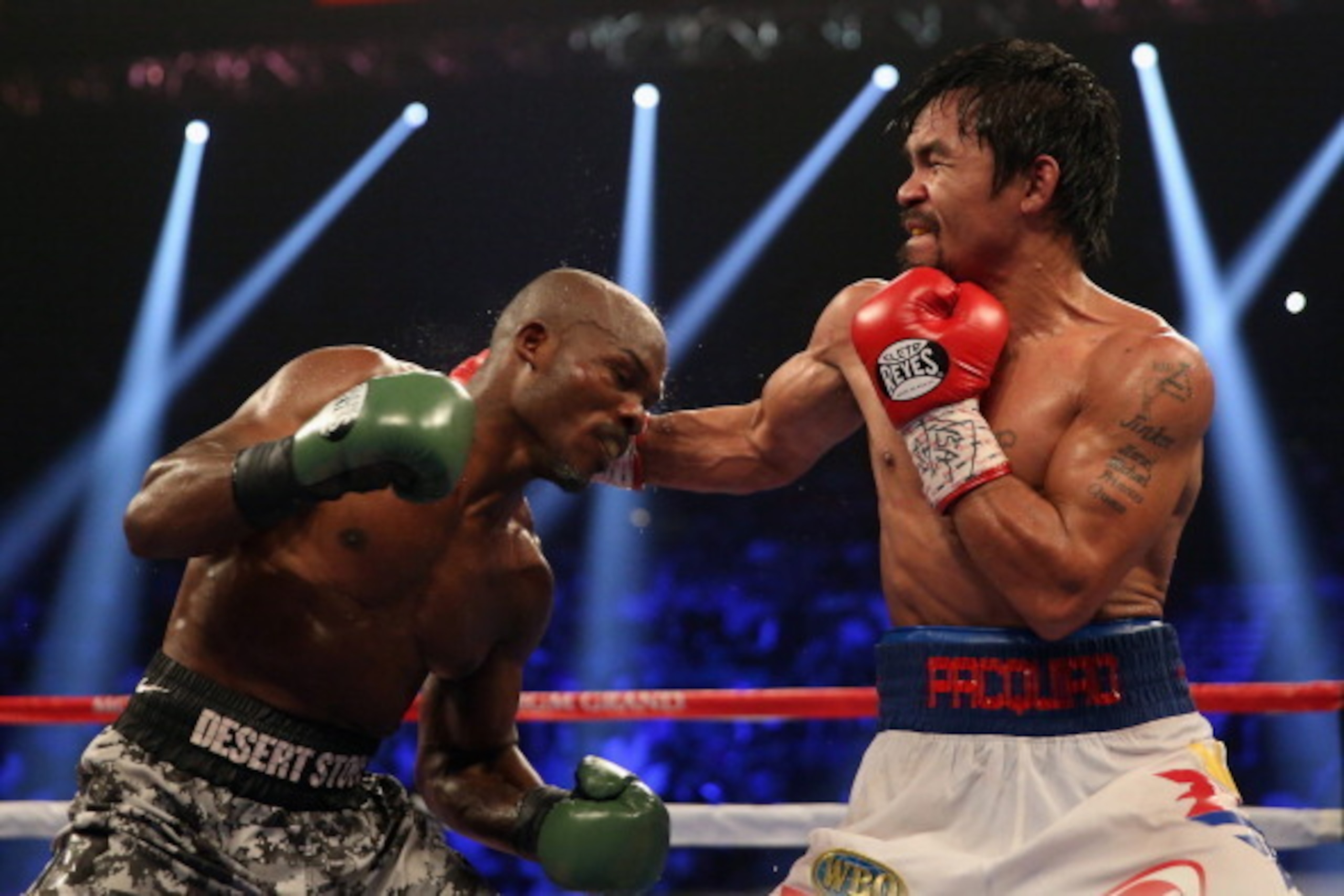 LAS VEGAS, NV - APRIL 12:  Manny Pacquiao throws a right hand at Timothy Bradley at the MGM Grand Garden Arena on April 12, 2014 in Las Vegas, Nevada.  (Photo by Jeff Gross/Getty Images)
