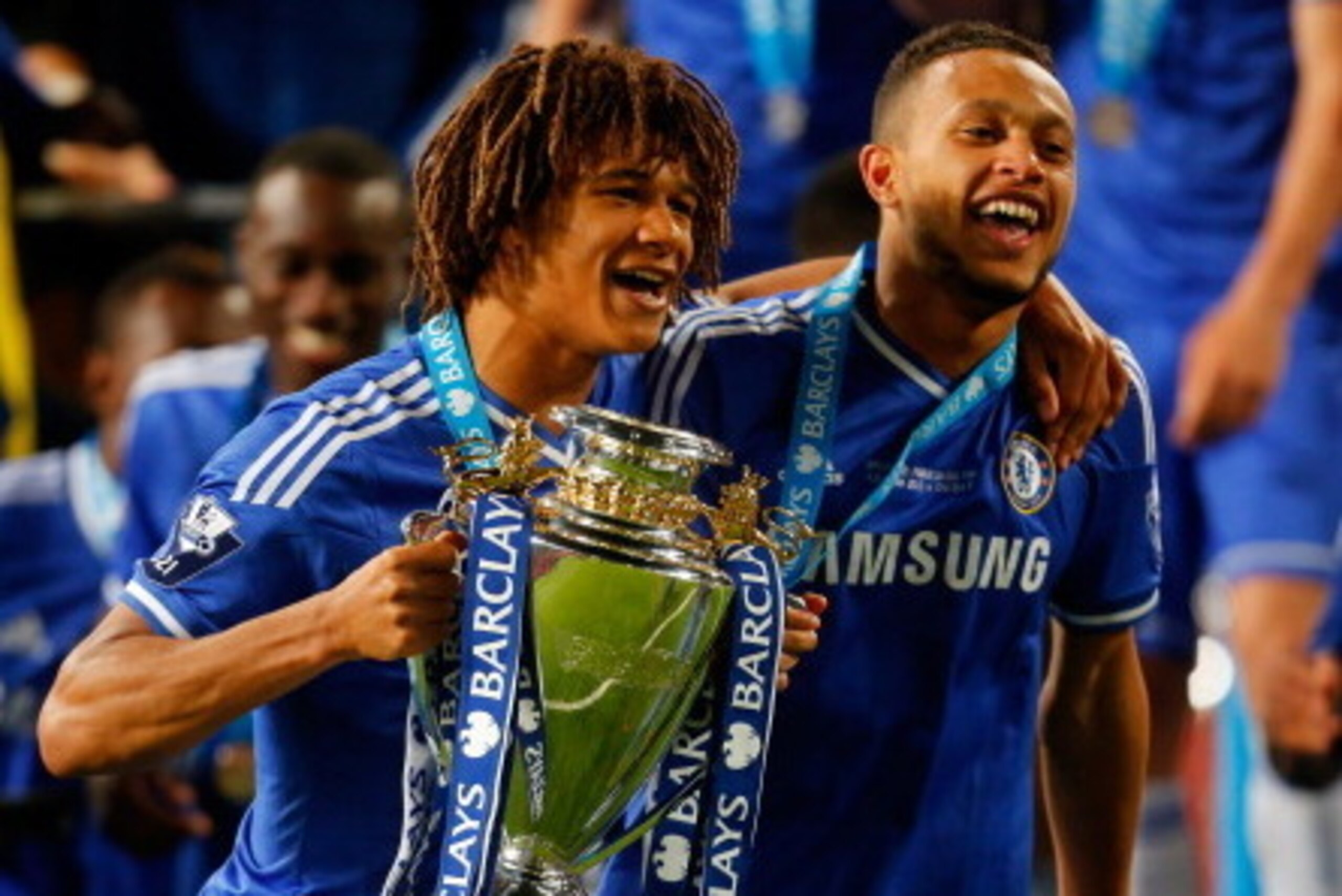 MANCHESTER, ENGLAND - MAY 14: Nathan Ake (L) and Lewis Baker of Chelsea celebrate with the trophy after the Barclays Under-21 Premier League Final match between Manchester United and Chelsea at Old Trafford on May 14, 2014 in Manchester, England. (Photo b
