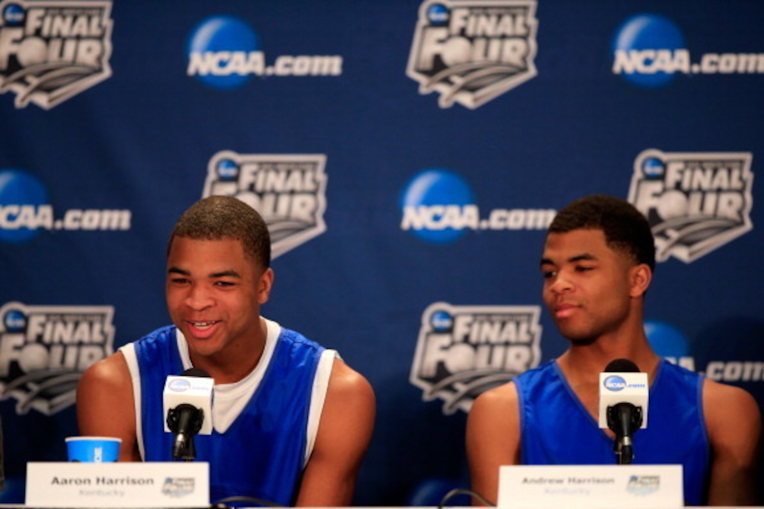 ARLINGTON, TX - APRIL 06:  Aaron Harrison of Kentucky talks with the media as Andrew Harrison looks on during an NCAA Men's Final Four press conference at AT&T Stadium on April 6, 2014 in Arlington, Texas.  (Photo by Jamie Squire/Getty Images)
