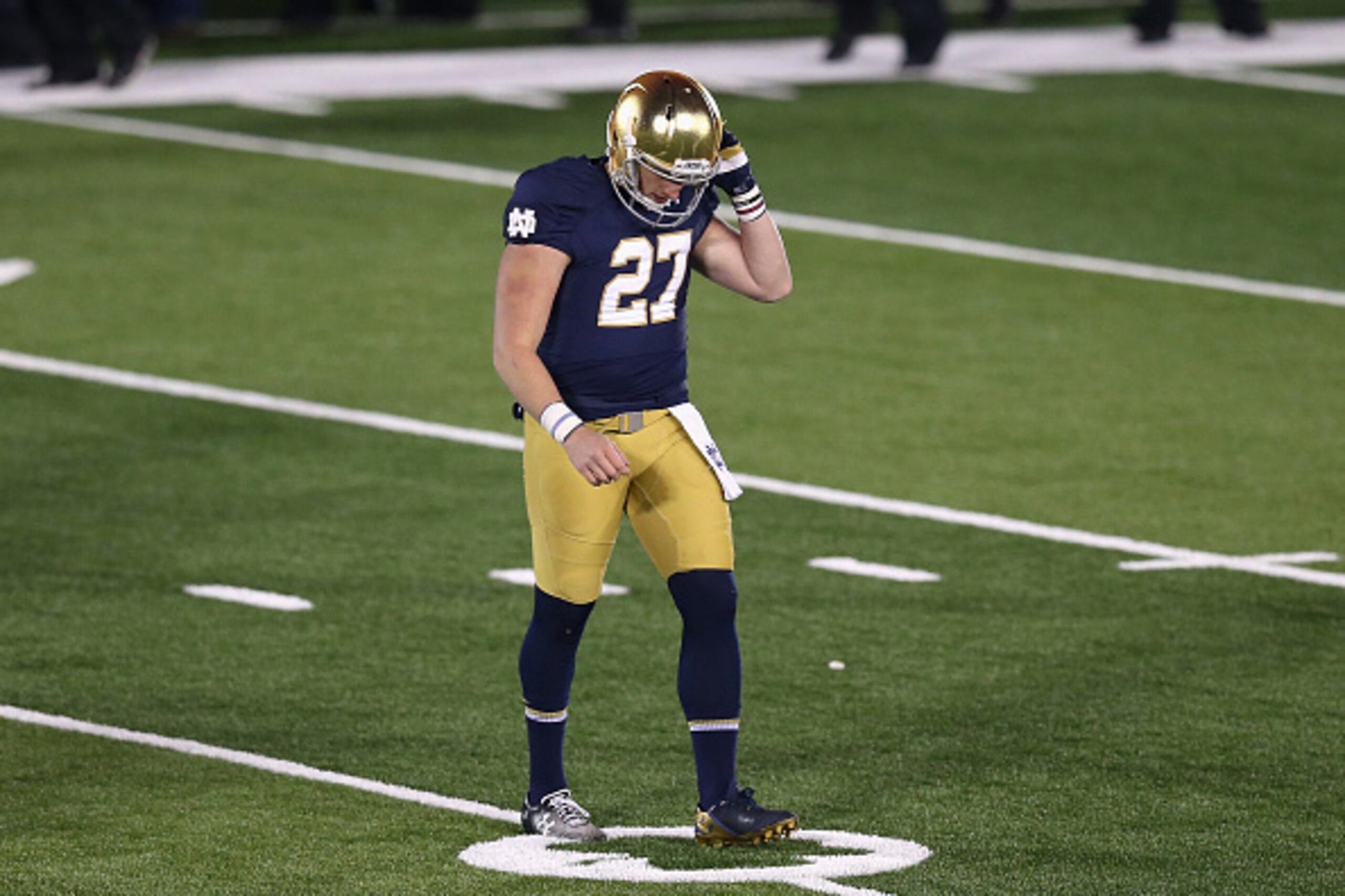 SOUTH BEND, IN - NOVEMBER 15: Kyle Brindza #27 of the Notre Dame Fighting Irish walks off of the field after missing a 42 yard field goal in overtime against the Northwestern Wildcats at Notre Dame Stadium on November 15, 2014 in South Bend, Indiana. Nort