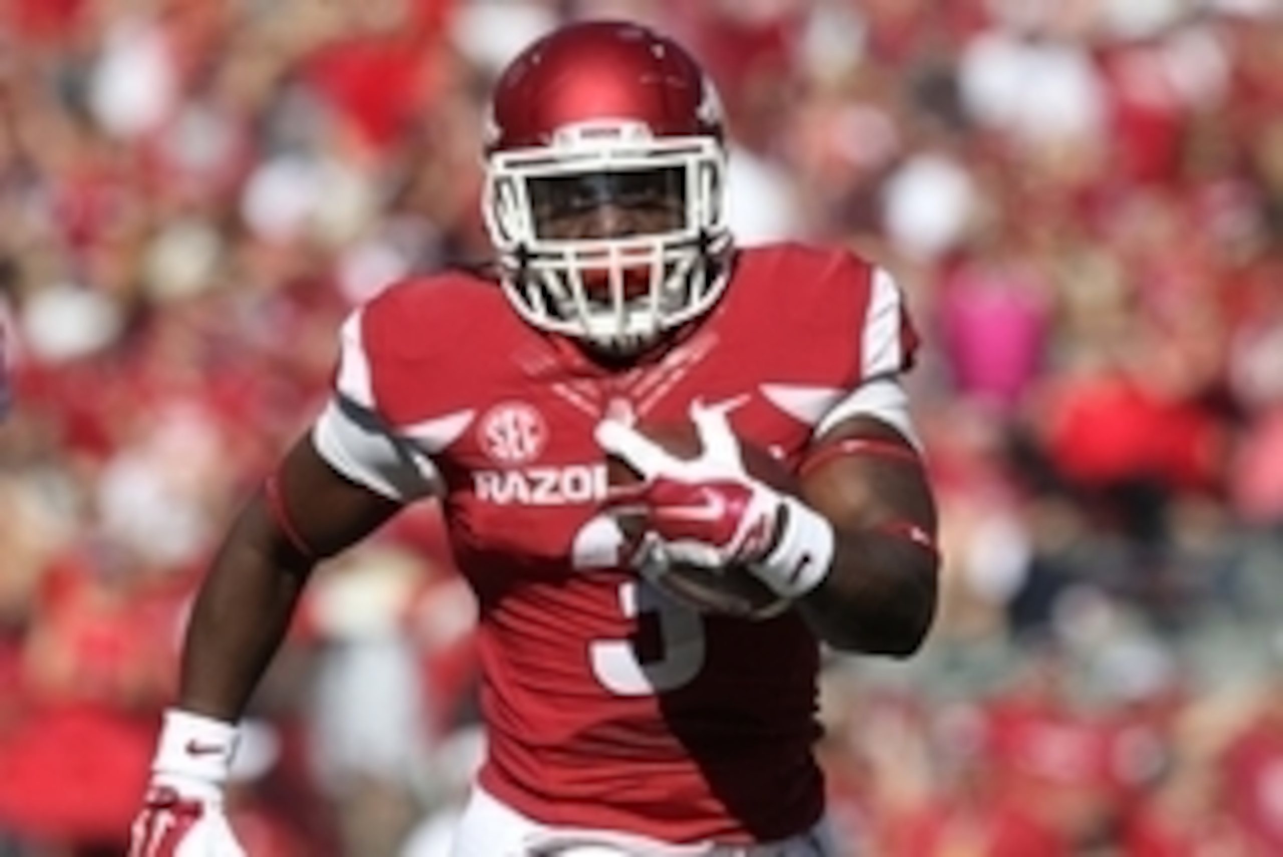 Oct 25, 2014; Fayetteville, AR, USA; Arkansas Razorbacks running back Alex Collins (3) rushes during the first quarter against the UAB Blazers at Donald W. Reynolds Razorback Stadium. Mandatory Credit: Nelson Chenault-USA TODAY Sports