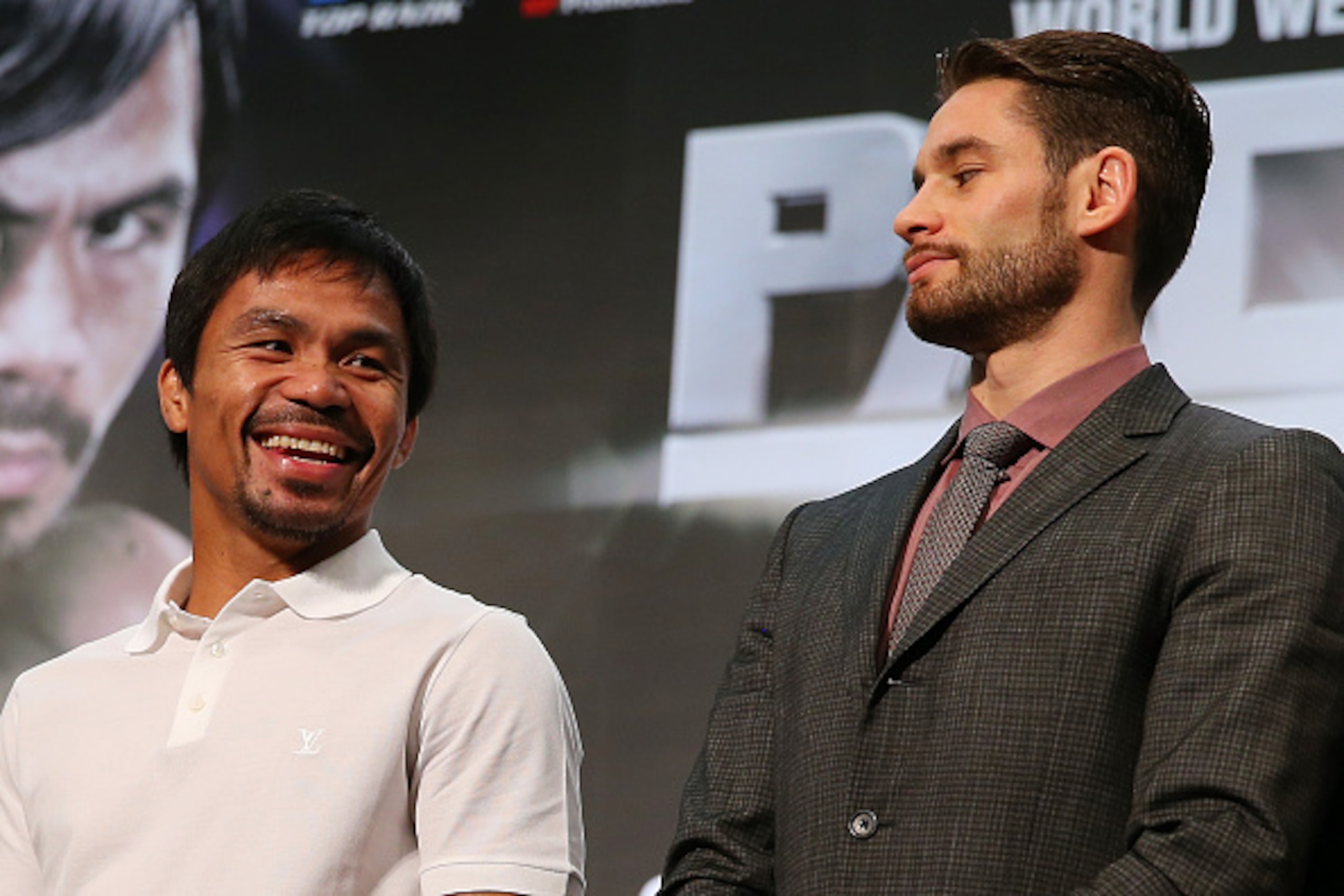 MACAU - NOVEMBER 19:  Manny Pacquiao and Chris Algieri pose during a press conference at The Venetian on November 19, 2014 in Macau, Macau.  (Photo by Chris Hyde/Getty Images)