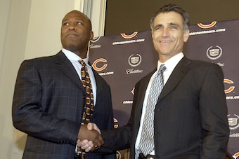 LIBERTYVILLE, IL - JANUARY 15:  Chicago Bears General Manager Jerry Angelo (R) congratulates former defensive coordinator for the St. Louis Rams, Lovie Smith (L), on his four year contract as head coach of the Chicago Bears at a media conference on Januar
