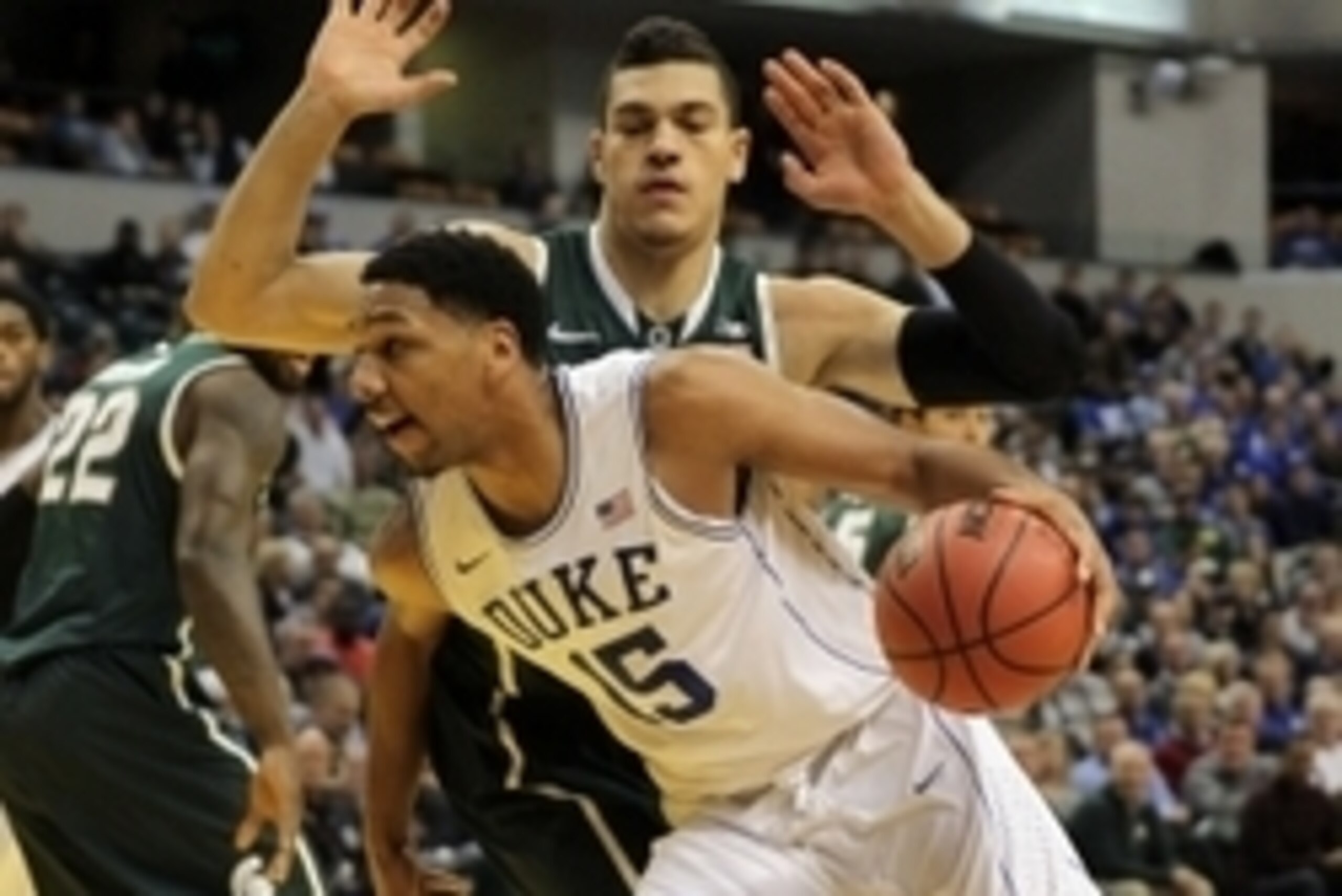 Nov 18, 2014; Indianapolis, IN, USA; Duke Blue Devils center Jahlil Okafor (15) drives to the basket with Michigan State Spartans forward Gavin Schilling (34) defending during the first half at Bankers Life Fieldhouse. Mandatory Credit: Pat Lovell-USA TOD