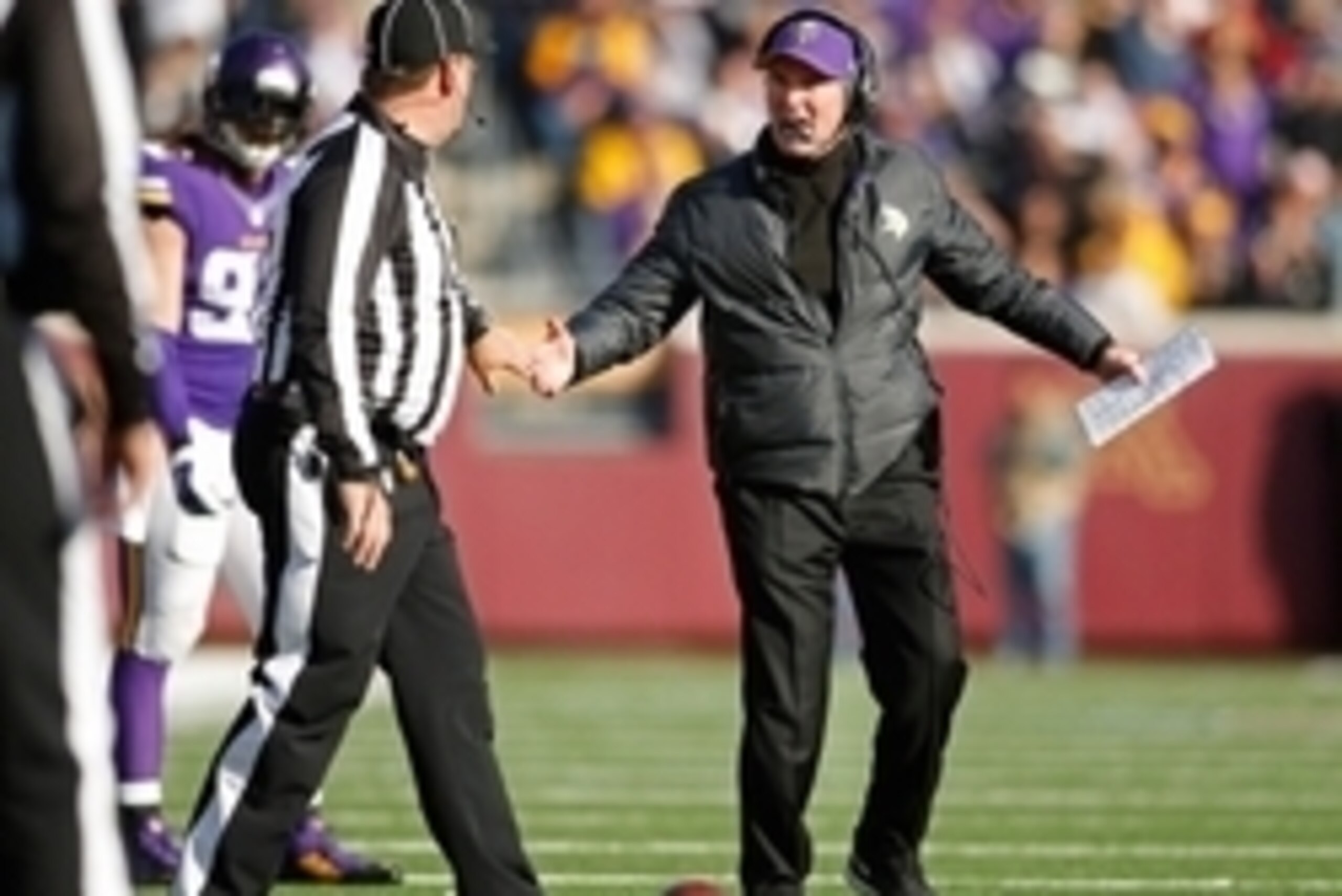 Nov 2, 2014; Minneapolis, MN, USA; Minnesota Vikings head coach Mike Zimmer questions a call to head linesman Jerry Bergman in the game against the Washington Redskins in the third quarter at TCF Bank Stadium. The Vikings win 29-26. Mandatory Credit: Bruc