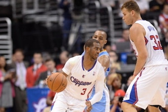 LOS ANGELES, CA - APRIL 15: Chris Paul #3 of the Los Angeles Clippers dribbles around a screen from teammate Blake Griffin #32 against Randy Foye #4 of the Denver Nuggets at Staples Center on April 15, 2014 in Los Angeles, California. NOTE TO USER: User e