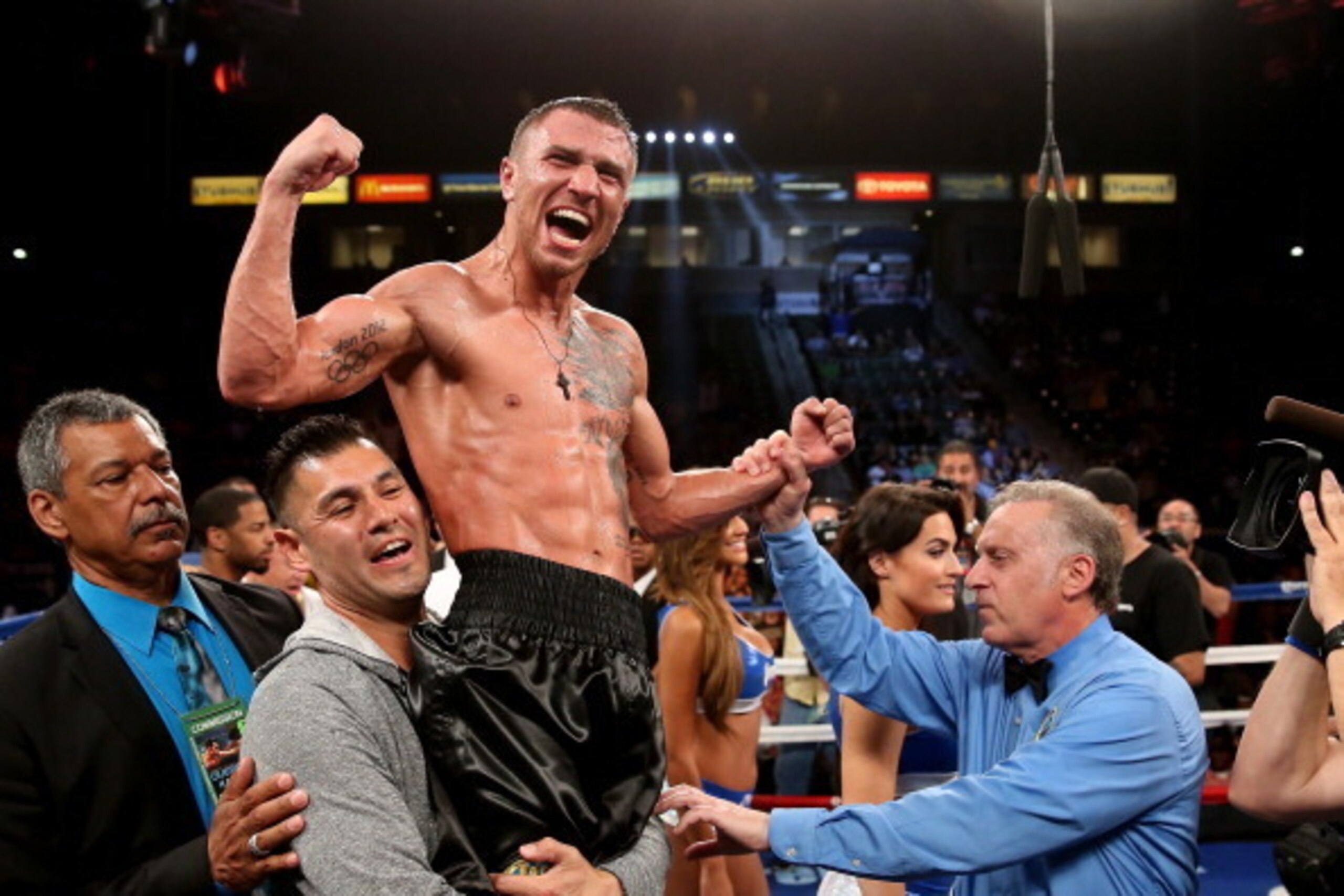 LOS ANGELES, CA - JUNE 21:  Vasyl Lomachenko celebrates after hearing the decision against Gary Russell Jr. in their WBO Featherwieight Title bout at StubHub Center on June 21, 2014 in Los Angeles, California.  Lomachenko won by split decision.  (Photo by