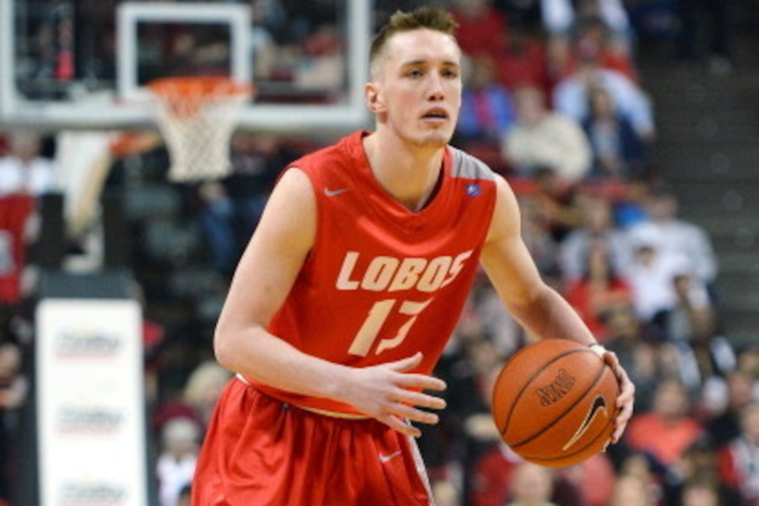 LAS VEGAS, NV - FEBRUARY 19:  Cullen Neal #13 of the New Mexico Lobos looks to pass against the UNLV Rebels during their game at the Thomas & Mack Center on February 19, 2014 in Las Vegas, Nevada. New Mexico won 68-56.  (Photo by Ethan Miller/Getty Images