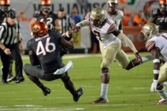 Nov 15, 2014; Miami Gardens, FL, USA; Florida State Seminoles defensive back Jalen Ramsey (8) strips the ball from Miami Hurricanes tight end Clive Walford (46) for a fumble during the first quarter at Sun Life Stadium. Mandatory Credit: Steve Mitchell-US