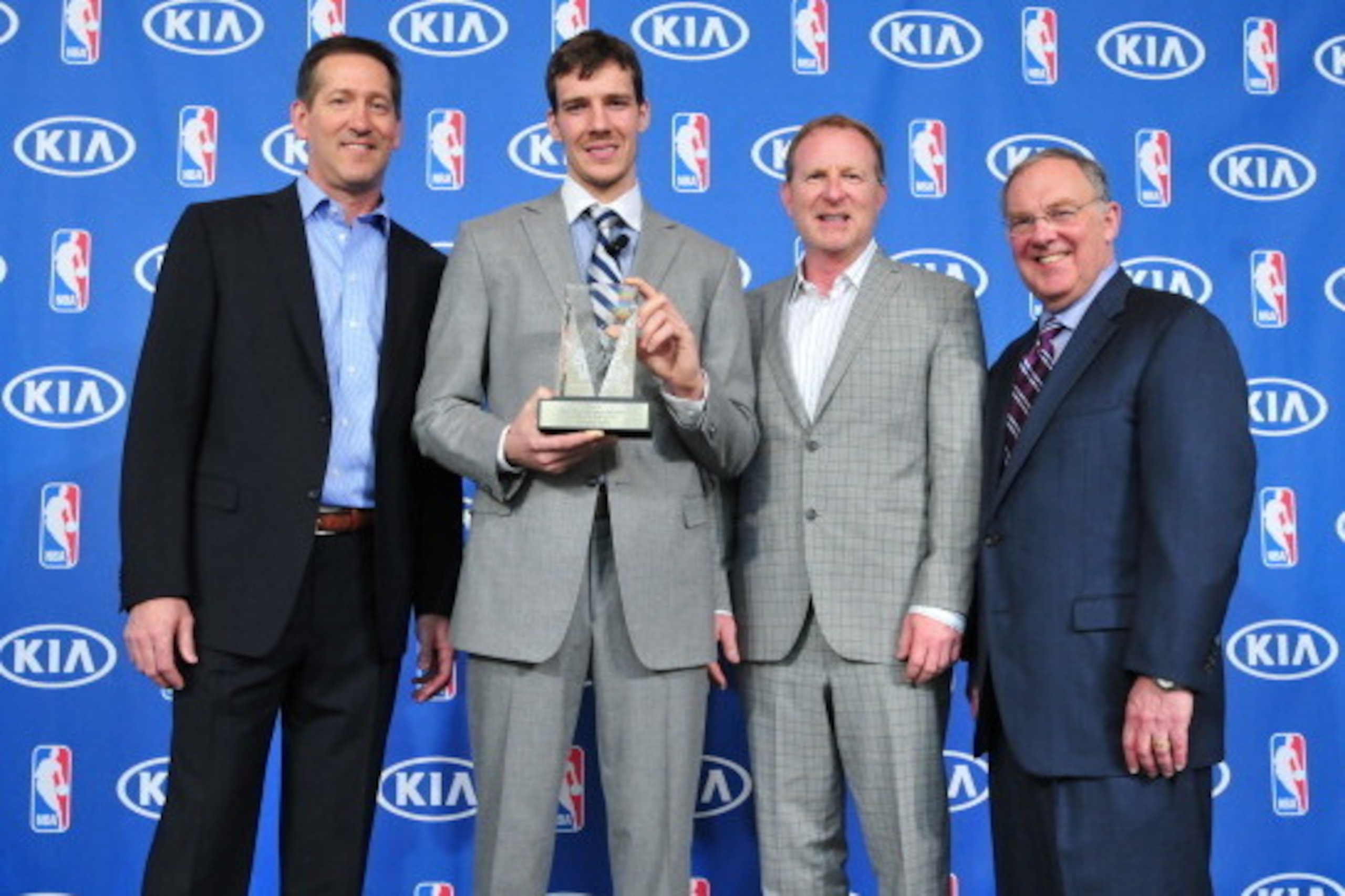 PHOENIX, AZ - APRIL 23: Goran Dragic #1 of the Phoenix Suns poses for a picture after he is awarded the KIA NBA Most Improved Player Award with Lon Babby President of Basketball Operations for the Phoenix Suns, Robert G. Sarver Managing Partner for the Ph
