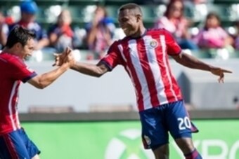 Oct 26, 2014; Carson, CA, USA; Chivas USA forward Felix Borja (20) celebrates a first half goal against San Jose Earthquakes with teammate Chivas USA forward Erick Torres (9) at StubHub Center. Mandatory Credit: Robert Hanashiro-USA TODAY Sports
