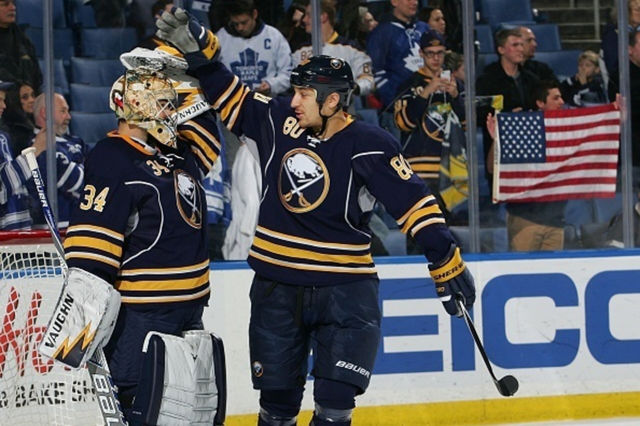 BUFFALO, NY - NOVEMBER 15: Michal Neuvirth #34 and Chris Stewart #80 of the Buffalo Sabres celebrate their 6-2 victory over the Toronto Maple Leafs on November 15, 2014 at the First Niagara Center in Buffalo, New York.  (Photo by Rob Marczynski/NHLI via G