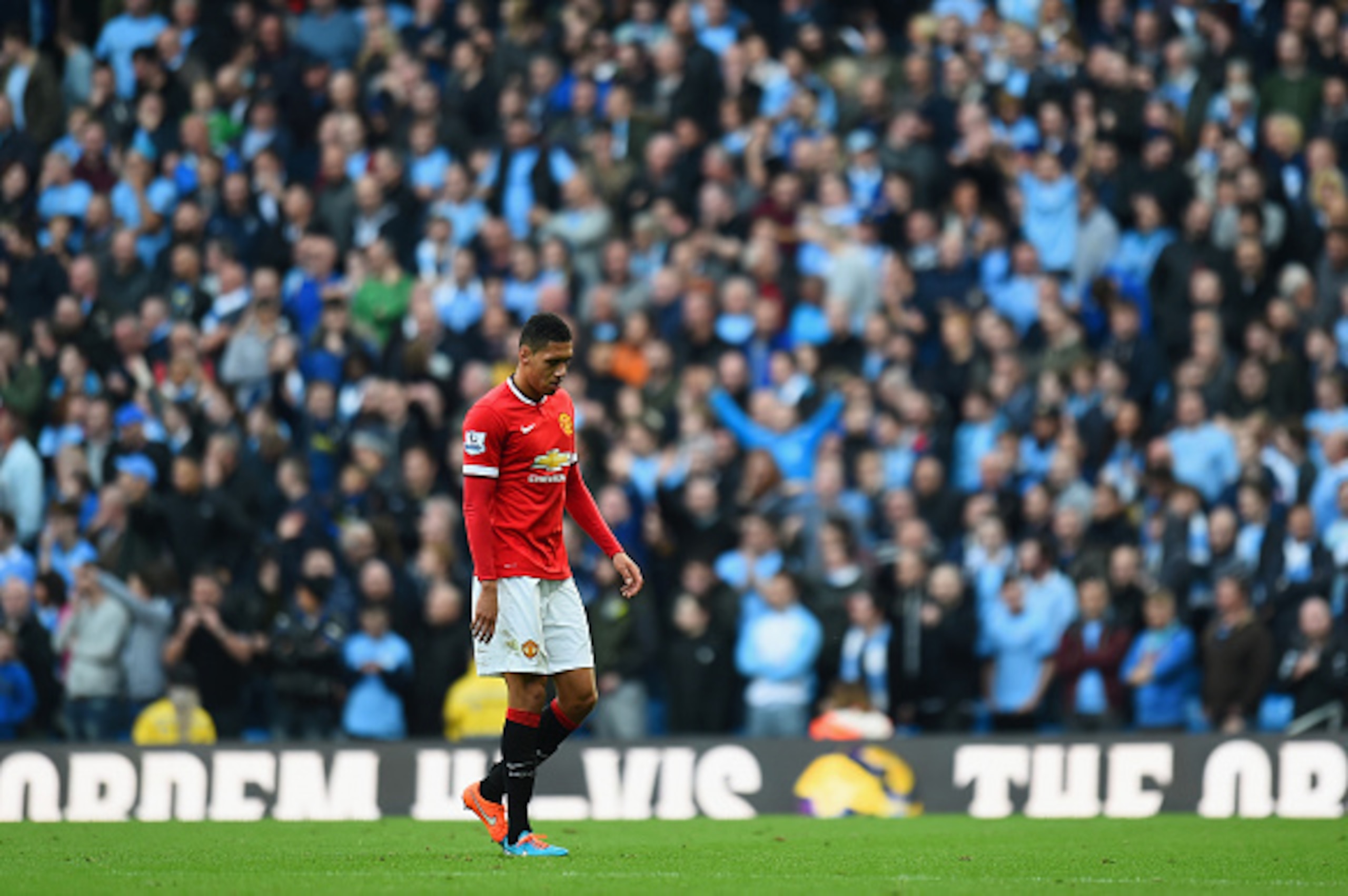 MANCHESTER, ENGLAND - NOVEMBER 02: Chris Smalling of Manchester United leaves the field after receiving a red card during the Barclays Premier League match between Manchester City and Manchester United at Etihad Stadium on November 2, 2014 in Manchester, MANCHESTER, ENGLAND - NOVEMBER 02: Chris Smalling of Manchester United leaves the field after receiving a red card during the Barclays Premier League match between Manchester City and Manchester United at Etihad Stadium on November 2, 2014 in Manchester,