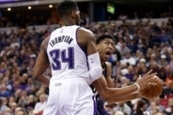 Nov 18, 2014; Sacramento, CA, USA; New Orleans Pelicans forward Anthony Davis (23) drives in against Sacramento Kings forward Jason Thompson (34) during the third quarter at Sleep Train Arena. The New Orleans Pelicans defeated the Sacramento Kings 106-100