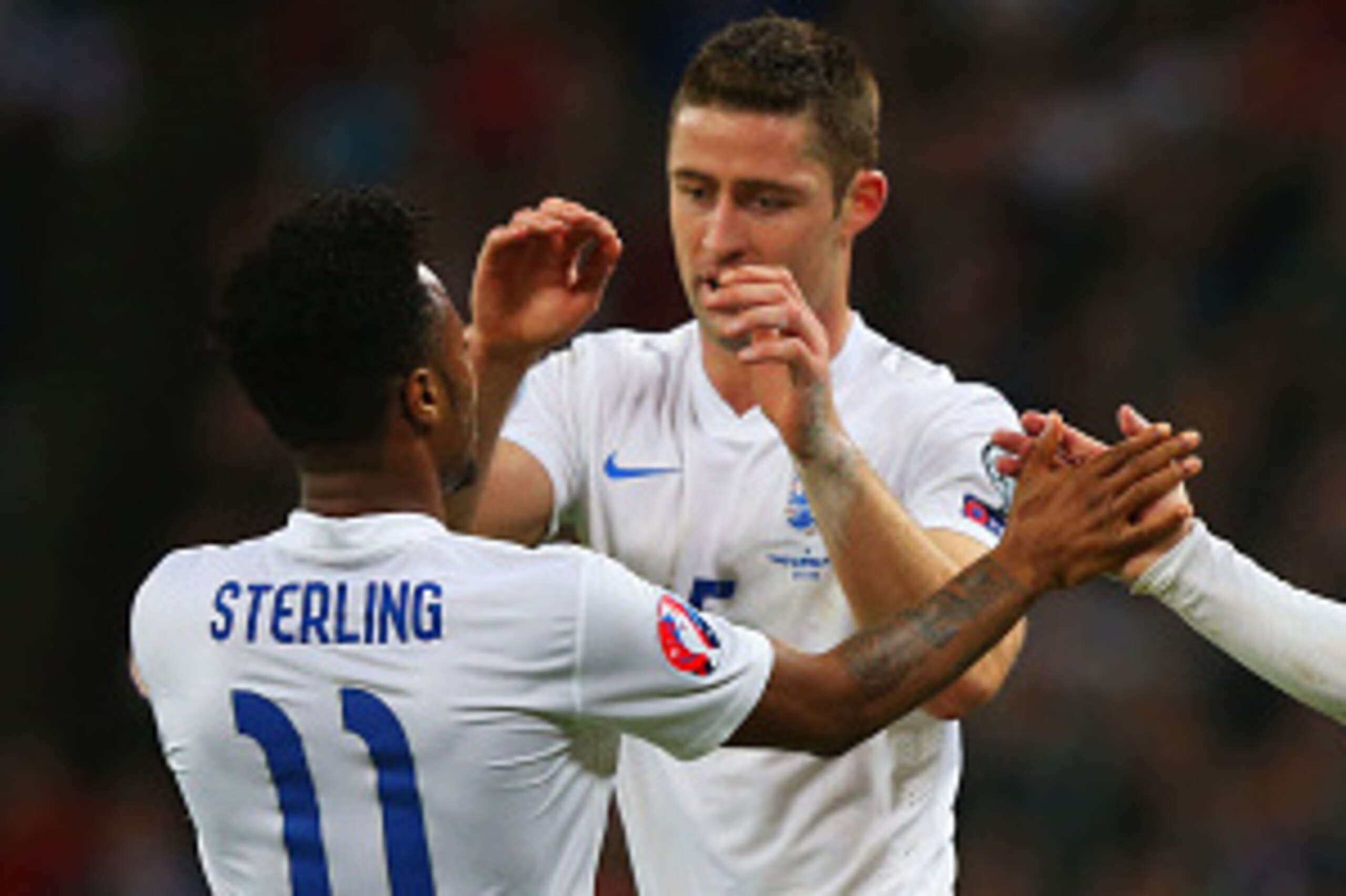 LONDON, ENGLAND - NOVEMBER 15:  Wayne Rooney of England (R) is congratulated by Gary Cahill of England and Raheem Sterling of EnglaRaheem Sterling of England (L) during the EURO 2016 Qualifier Group E match between England and Slovenia at Wembley Stadium 