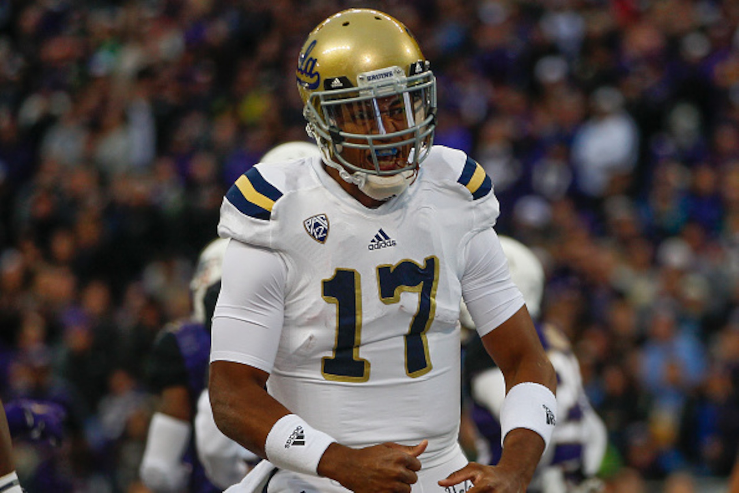 SEATTLE, WA - NOVEMBER 08:  Quarterback Brett Hundley #17 of the UCLA Bruins reacts after scoring a touchdown in the first quarter against the Washington Huskies on November 8, 2014 at Husky Stadium in Seattle, Washington.  (Photo by Otto Greule Jr/Getty 