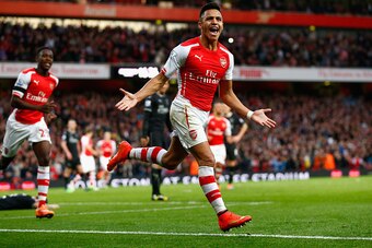 LONDON, ENGLAND - NOVEMBER 01:  Alexis Sanchez of Arsenal celebrates scoring the first goal during the Barclays Premier League match between Arsenal and Burnley at Emirates Stadium on November 1, 2014 in London, England.  (Photo by Julian Finney/Getty Ima