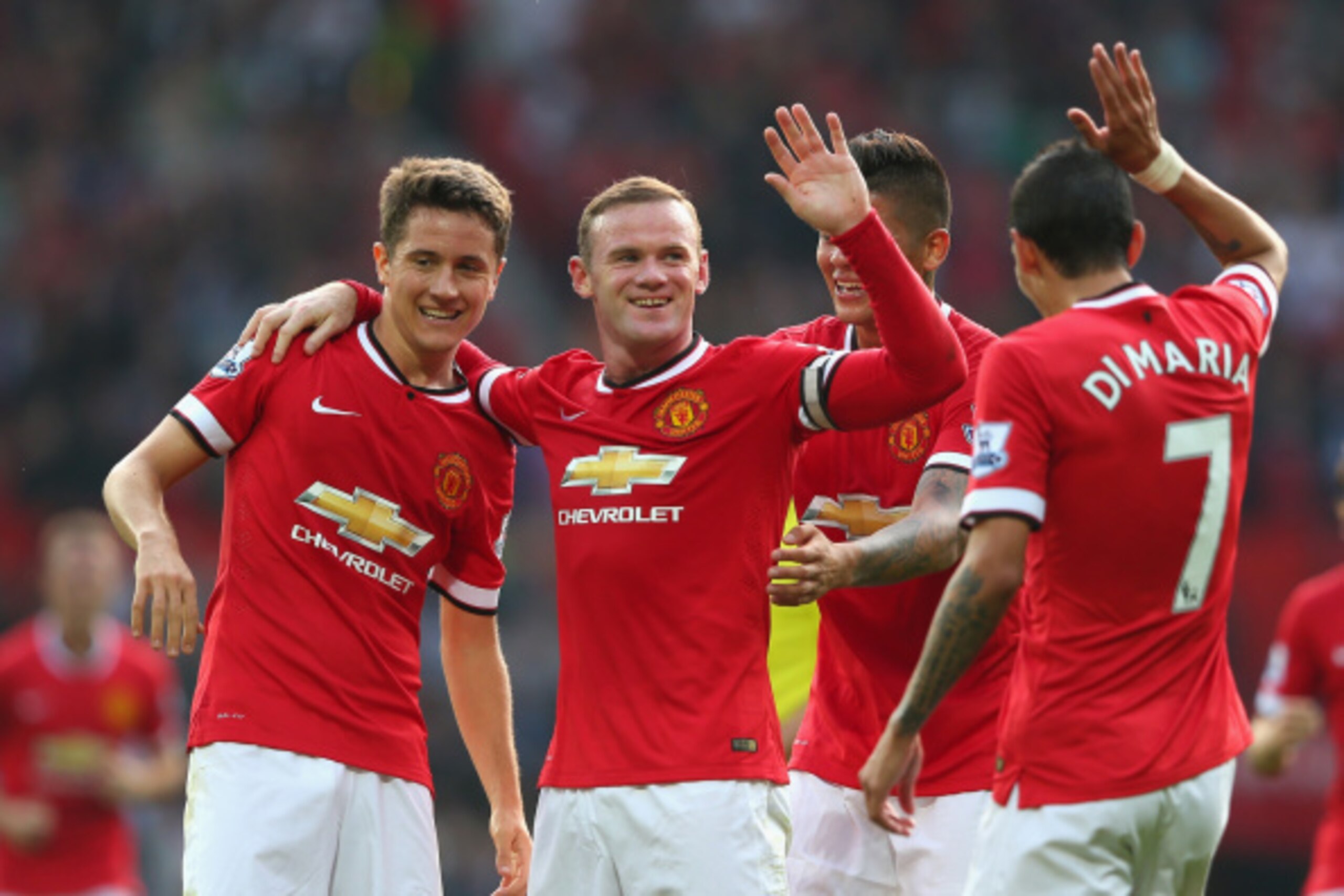 MANCHESTER, ENGLAND - SEPTEMBER 14:  Wayne Rooney of Manchester United celebrates scoring the third goal with team-mates Ander Herrera (L), Marcos Rojo and Angel Di Maria during the Barclays Premier League match between Manchester United and Queens Park R