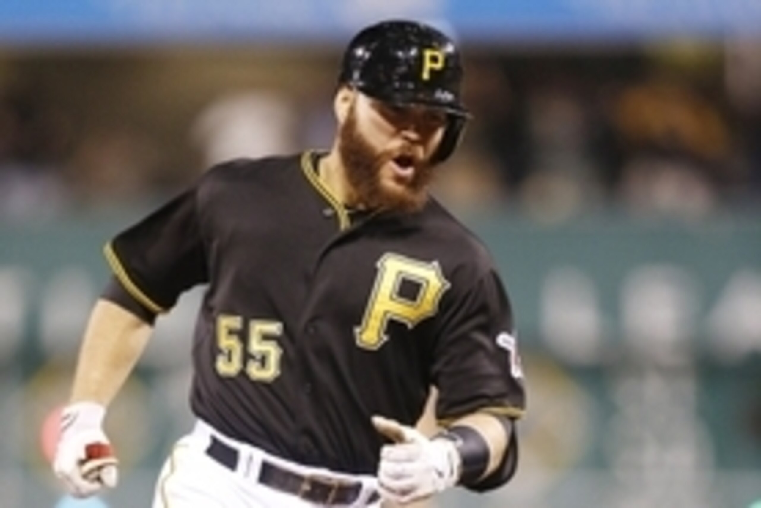 Sep 19, 2014; Pittsburgh, PA, USA; Pittsburgh Pirates catcher Russell Martin (55) reacts as he rounds the bases after hitting a three run home run against the Milwaukee Brewers during the eighth inning at PNC Park. The Pirates won 3-2. Mandatory Credit: C