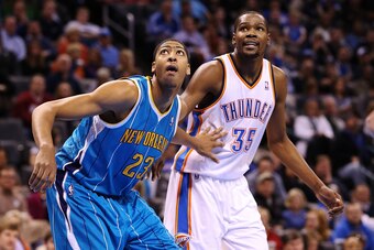 Dec 12, 2012; Oklahoma City, OK, USA; Oklahoma City Thunder small forward Kevin Durant (35) battles for a rebound with New Orleans Hornets power forward Anthony Davis (23) during the second half at Chesapeake Energy Arena. Mandatory Credit: Kevin Jairaj-U