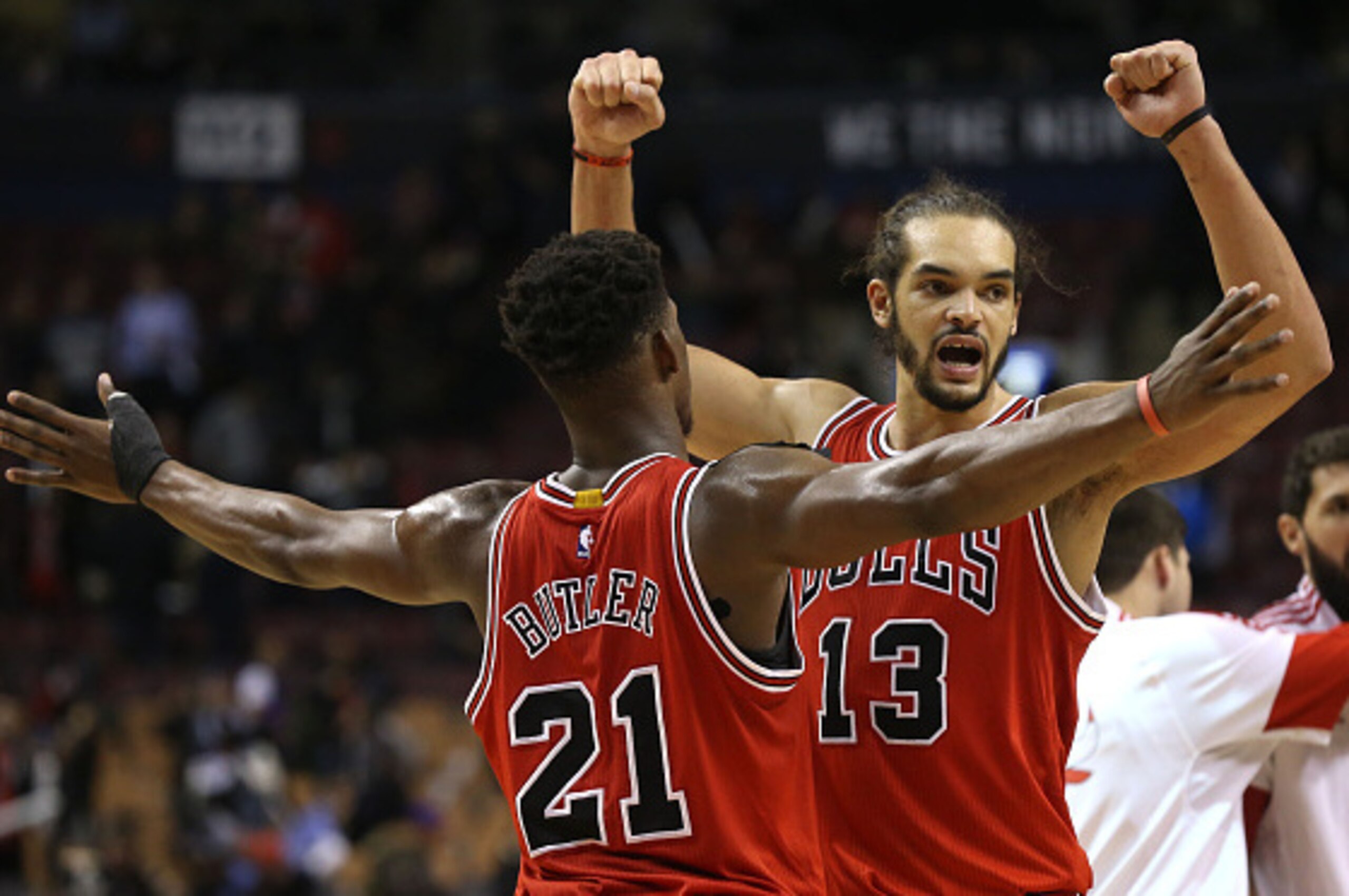 TORONTO,ON - NOVEMBER 13:  Joakim Noah #13 of the Chicago Bulls and Jimmy Butler #21 of the Chicago Bulls celebrate their win over the Toronto Raptors during their NBA game at the Air Canada Centre on November 13, 2014 in Toronto, Ontario, Canada. NOTE TO