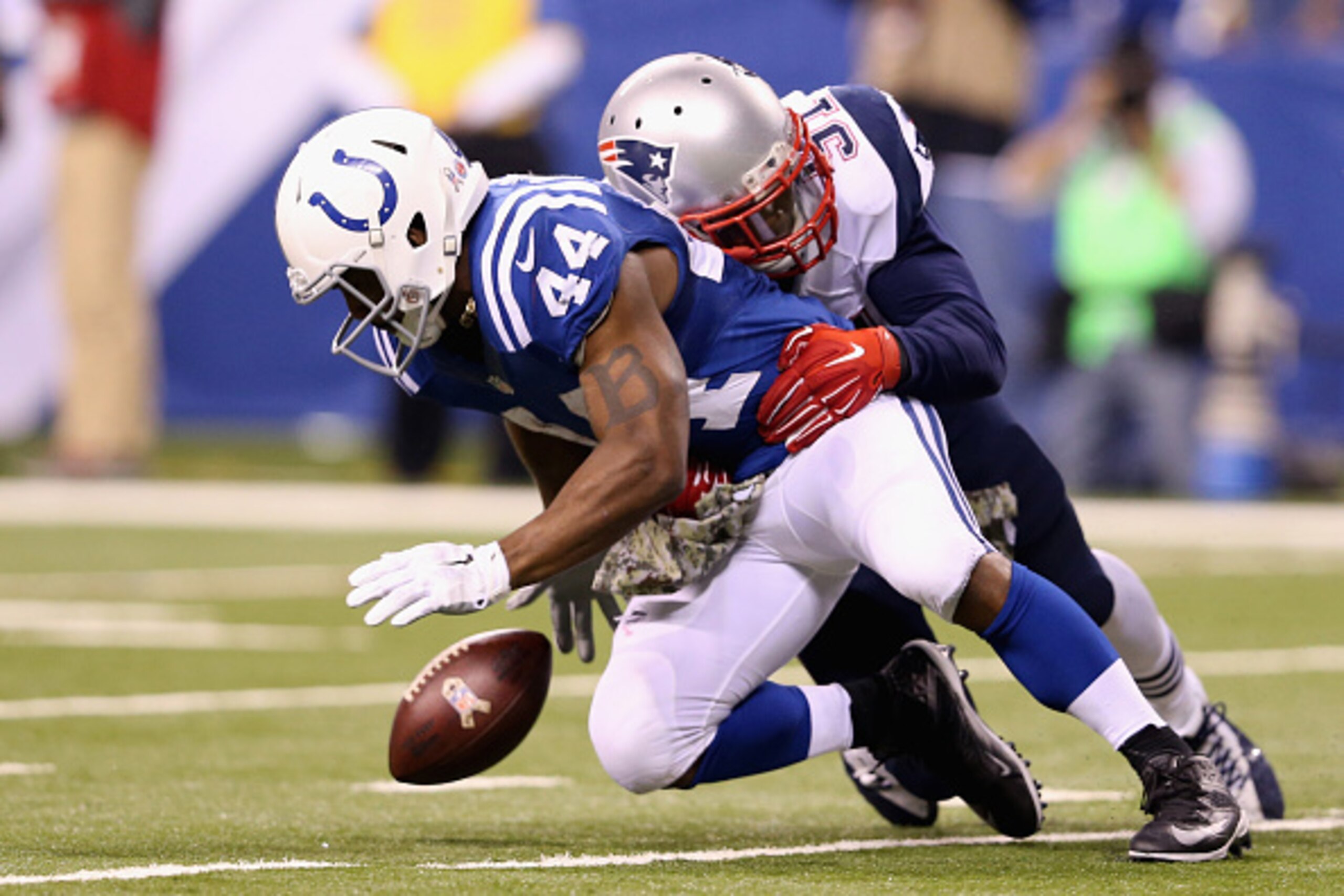 INDIANAPOLIS, IN - NOVEMBER 16:   Ahmad Bradshaw #44 of the Indianapolis Colts fumbles after being hit by Jamie Collins #91 of the New England Patriots during the game at Lucas Oil Stadium on November 16, 2014 in Indianapolis, Indiana.  (Photo by Andy Lyo