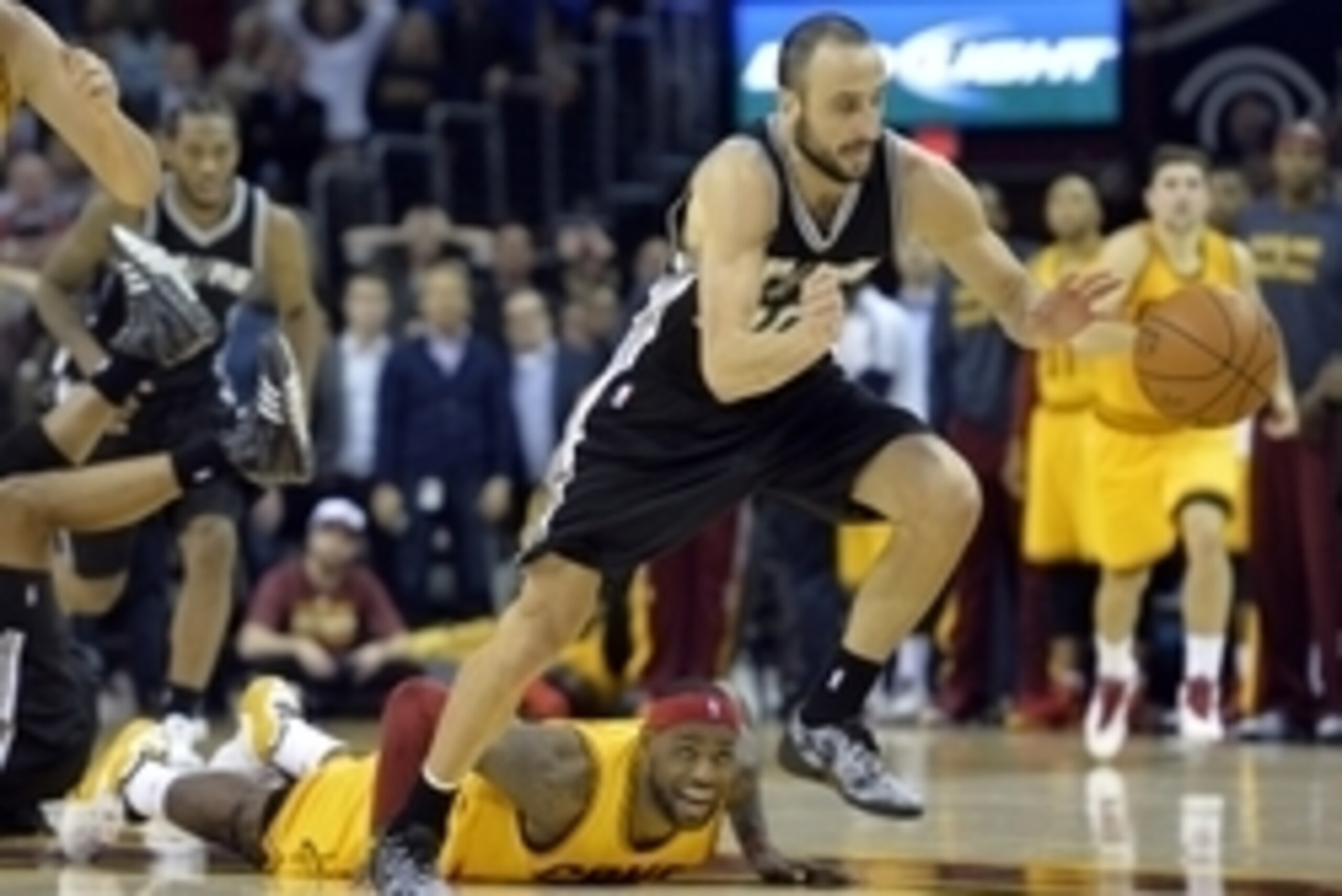 Nov 19, 2014; Cleveland, OH, USA; Cleveland Cavaliers forward LeBron James (23) watches after losing the ball to San Antonio Spurs guard Manu Ginobili (20) in the final seconds at Quicken Loans Arena. Mandatory Credit: David Richard-USA TODAY Sports