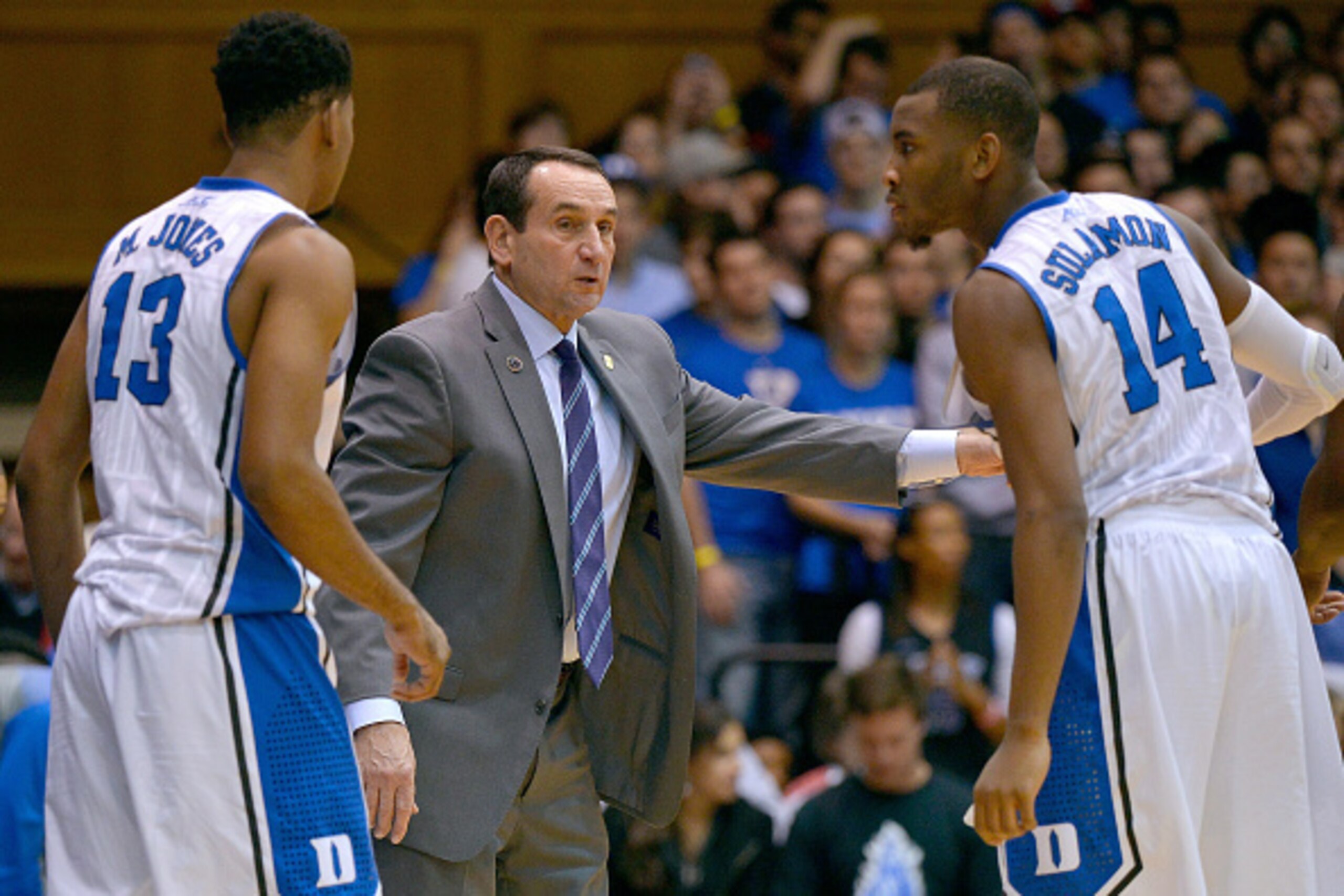 DURHAM, NC - NOVEMBER 14:  Head coach Mike Krzyzewski talks to Matt Jones #13 and Rasheed Sulaimon #14 of the Duke Blue Devils during their game against the Presbyterian Blue Hose at Cameron Indoor Stadium on November 14, 2014 in Durham, North Carolina.  